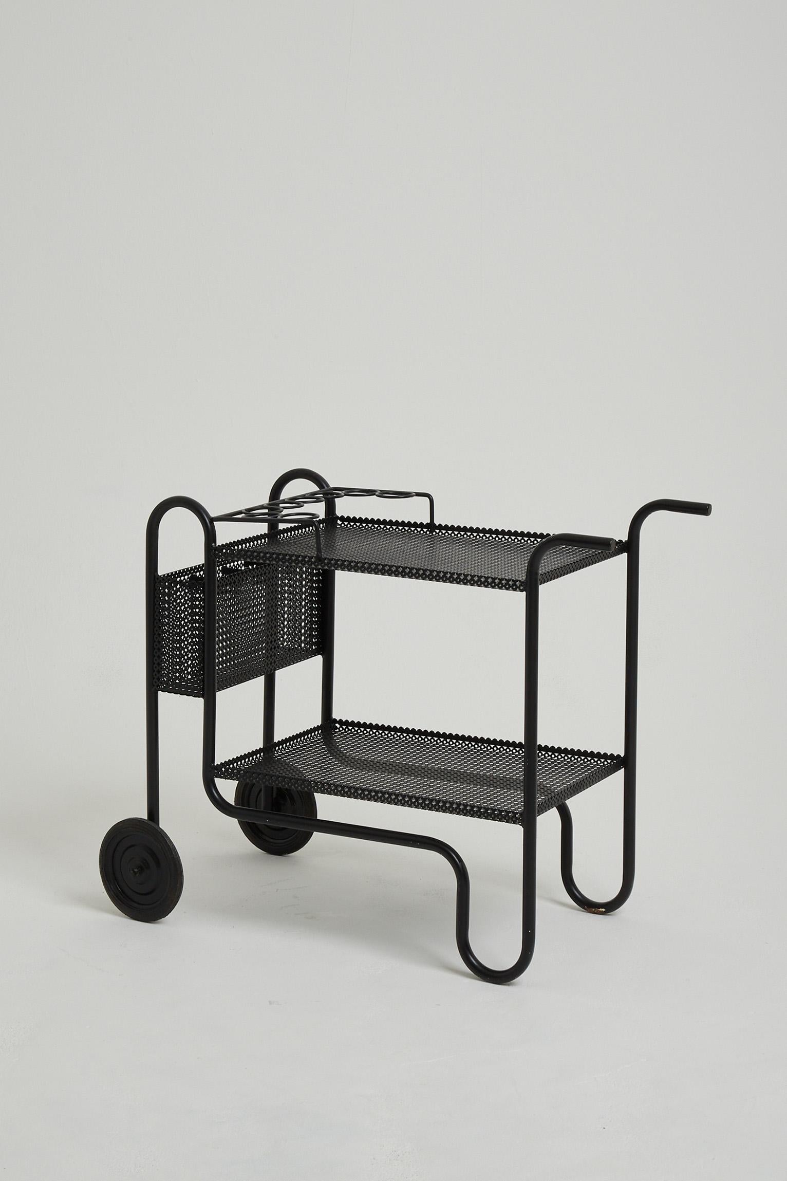 A black enamelled iron and rigitule drinks trolley, attributed to Mathieu Matégot (1910-2001).
France, Circa 1955.