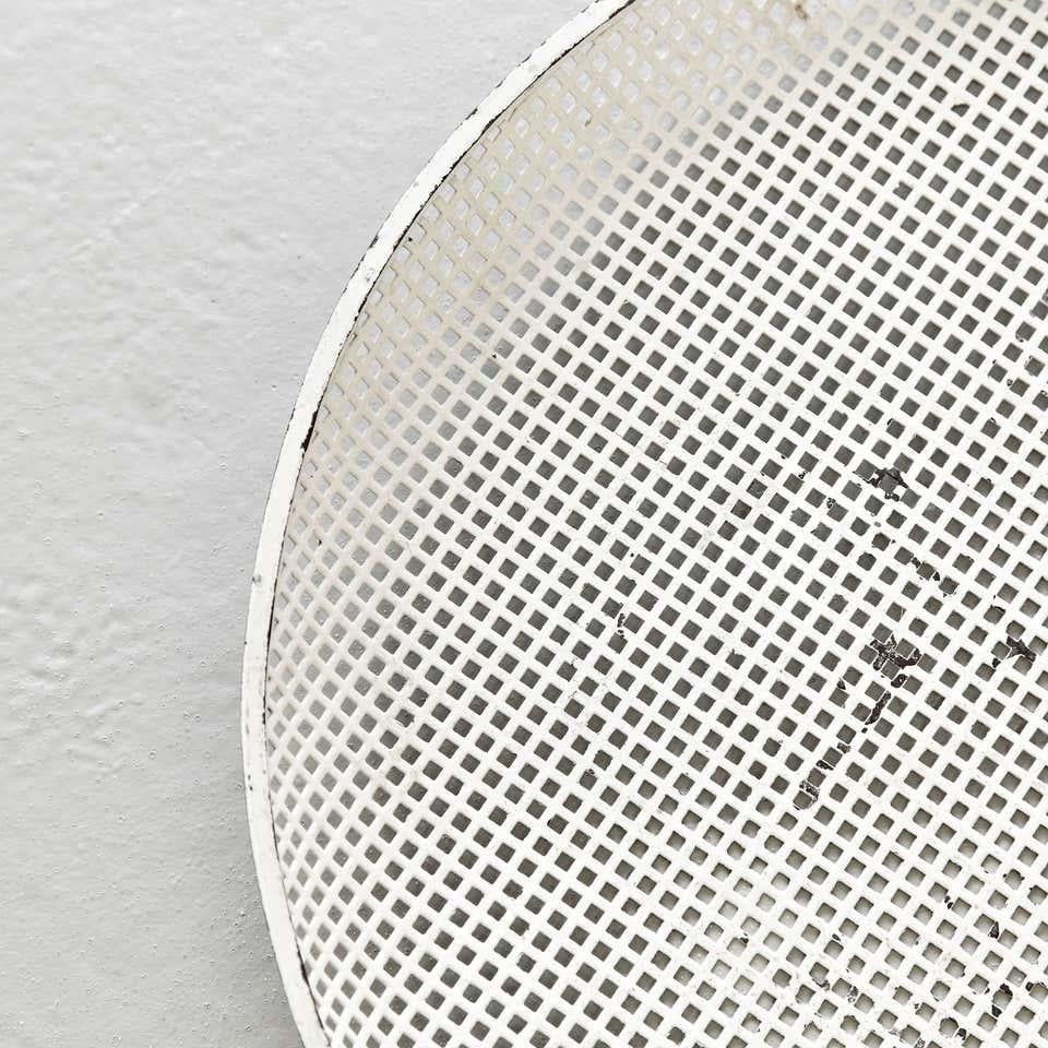 Enameled metal plate designed by Mathieu Matégot.
Manufactured by Ateliers Matégot (France), circa 1950.
Lacquered perforated metal with original paint.

In good original condition, with minor wear consistent with age and use, preserving a beautiful