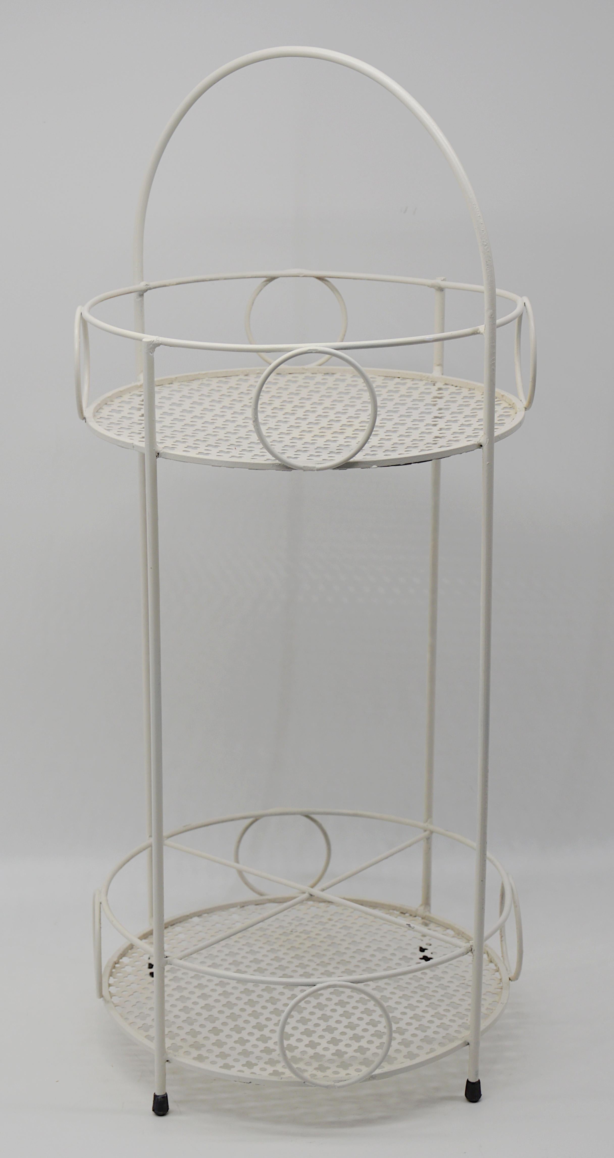 Midcentury small bar table by Mathieu Matégot, France, 1950s. Metal and perforated metal. Measures: height : 23.6
