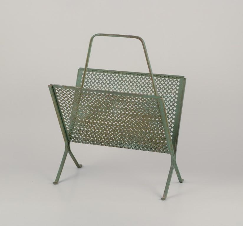 Mathieu Mategot (1910-2001), a Hungarian-French industrial designer. 
Magazine holder in green-patinated metal.
Approximately 1960.
In excellent condition with a fine patina, oxidized. Minor signs of use.
Dimensions: W 32.5 cm x D 19.5 cm x H 43.0