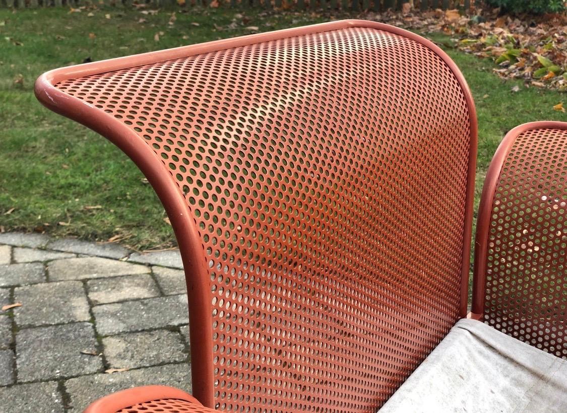 Features perforated metal work with the classic Matégot sling seat support. Outdoor or indoor versatility.
Buyer would need to add their own seat cushion if desired. Arm height is 19.75, all other dimensions are below.