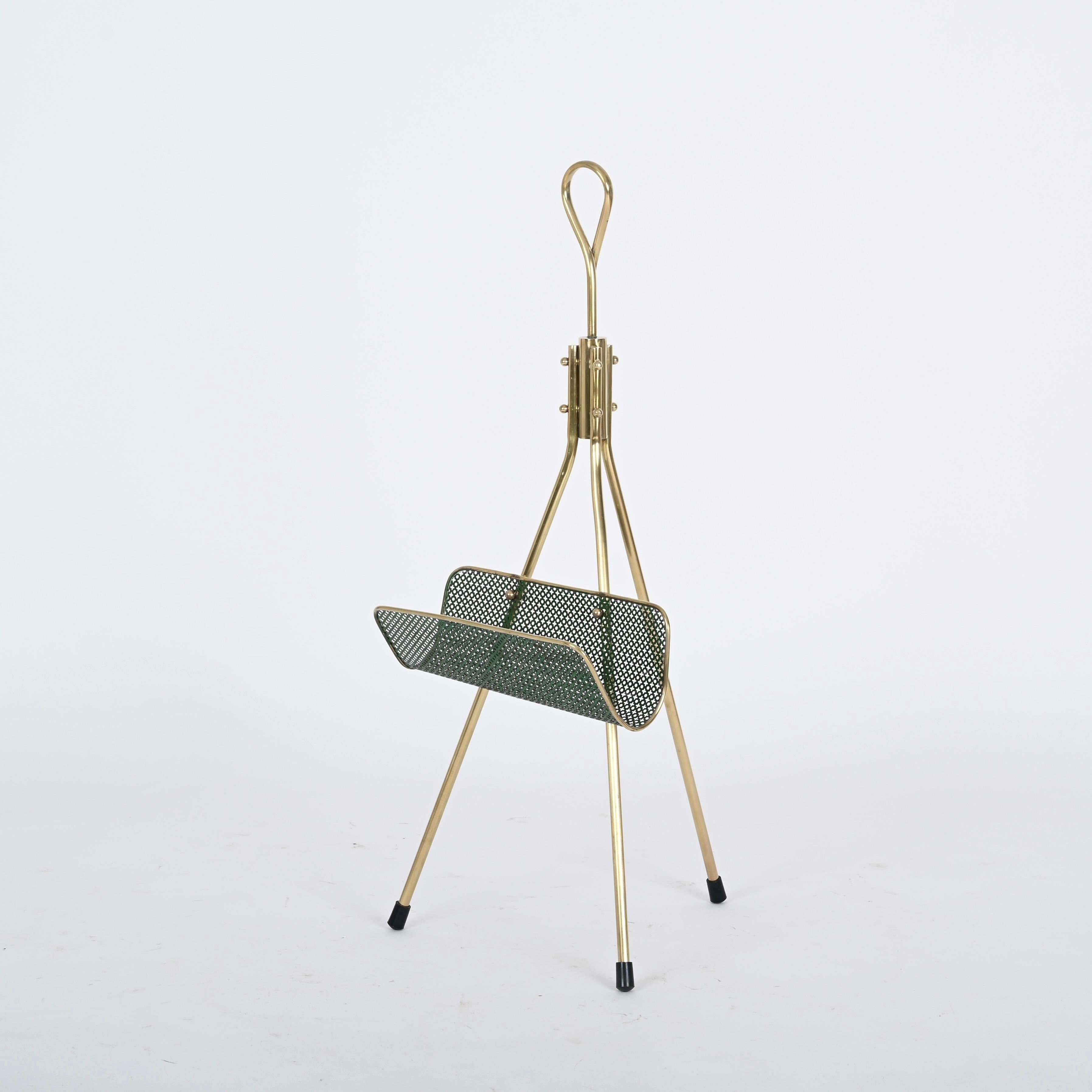 Wonderful and incredibly unique mid-century magazine rack in brass and enameled and perforated green metal. This one of a kind  piece was realized in France during the 1950s by Mathieu Mategot.

In fabulous condition and with a beautiful golden