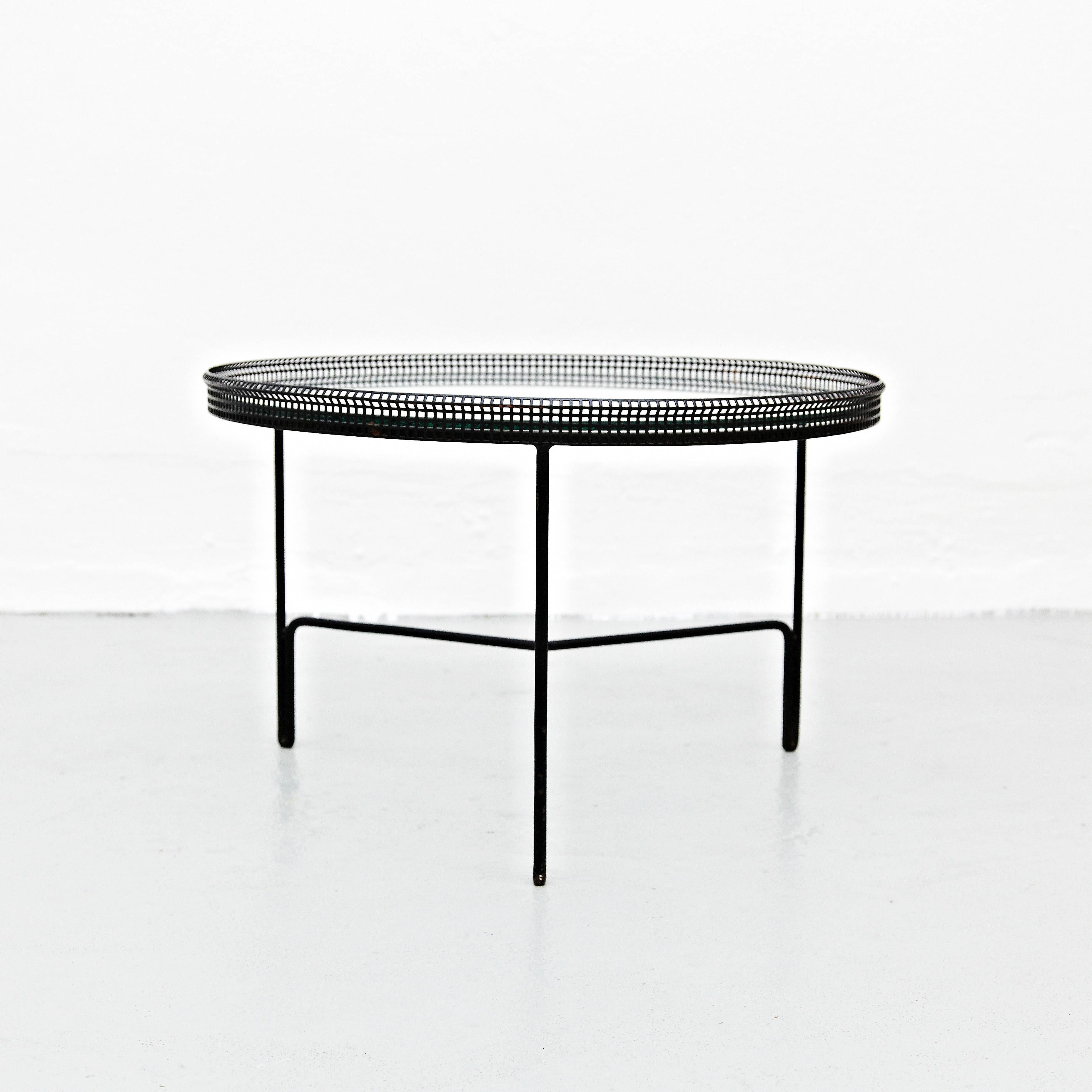 Coffee table designed by Mathieu Matégot.
Manufactured by Ateliers Matégot (France), circa 1950.
Lacquered perforated metal with original paint and glass.

In good original condition, with minor wear consistent with age and use, preserving a