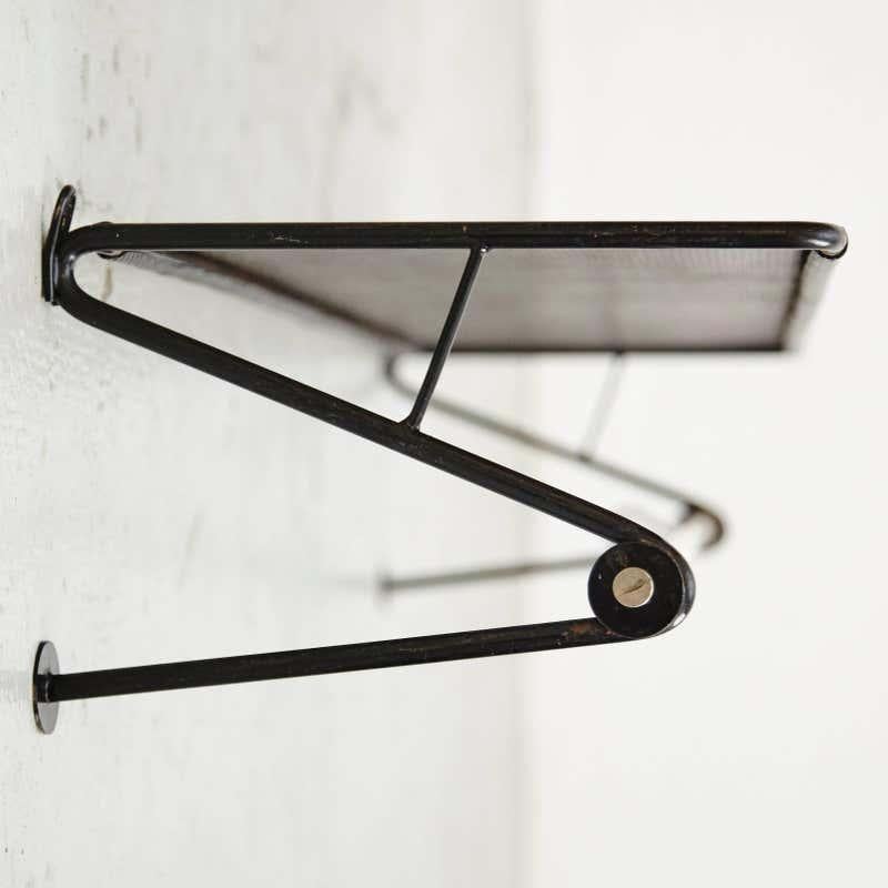 Coat rack designed by Mathieu Matégot.
Manufactured by Artimeta (Netherland), circa 1950.
Perforated and lacquered metal.

In good original condition, with minor wear consistent with age and use, preserving a beautiful patina.

Mathieu