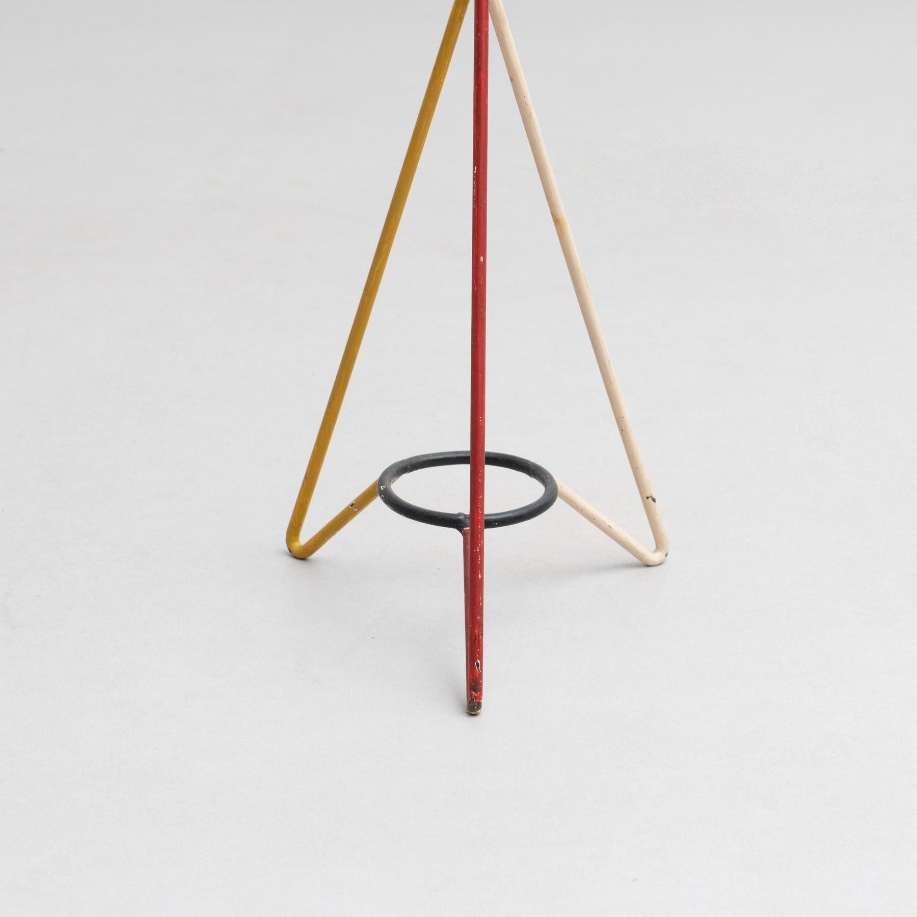 Plant stand designed by Mathieu Matégot for three pots, circa 1950.

Manufactured in France.

Materials:
Lacquered metal.

In good original condition, with minor wear consistent with age and use, preserving a beautiful patina. Painted in