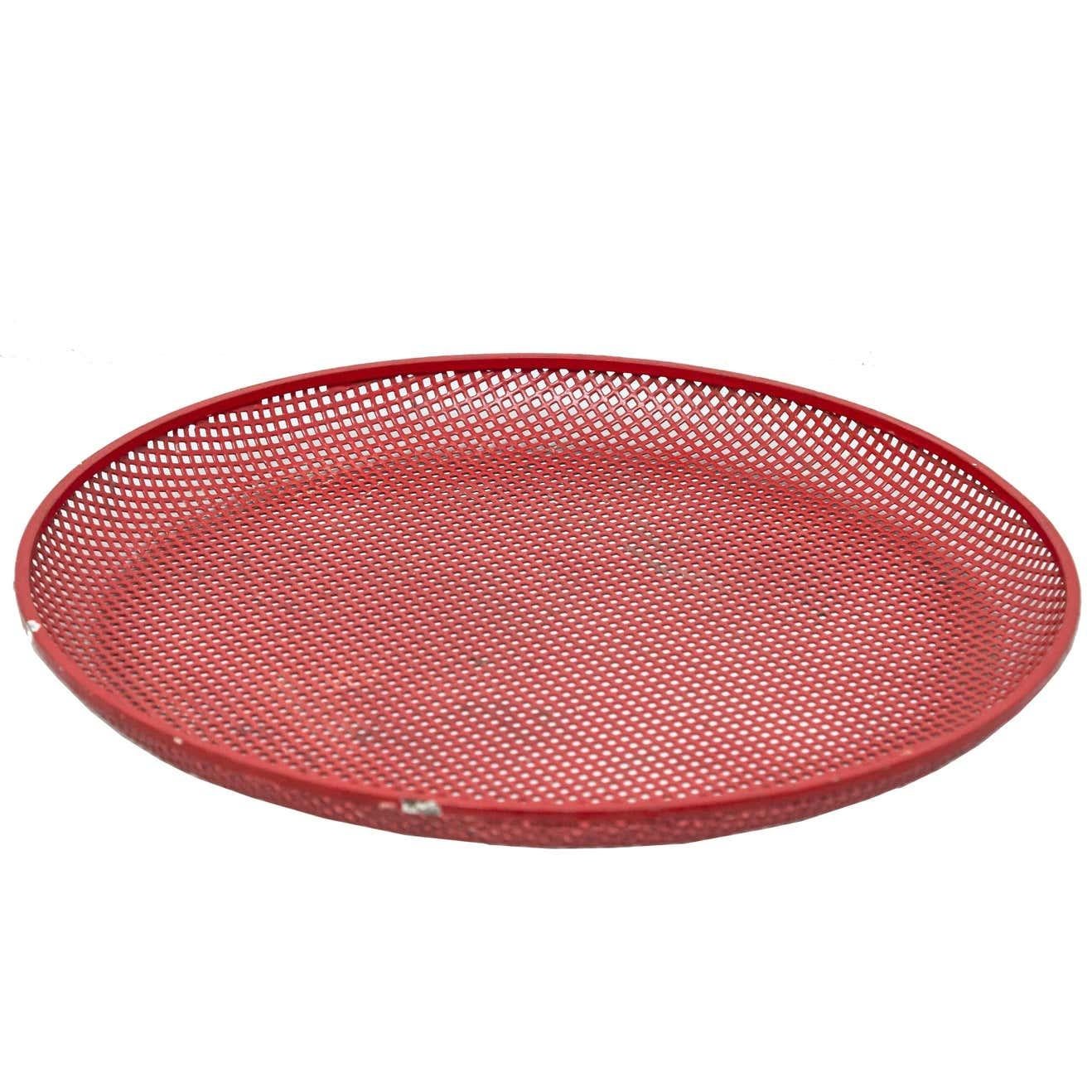 Enameled metal plate designed by Mathieu Matégot.
Manufactured by Artimeta (Holland), circa 1950.
Lacquered perforated metal, seem to be repainted many years ago.

In good original condition, with minor wear consistent with age and use, preserving a
