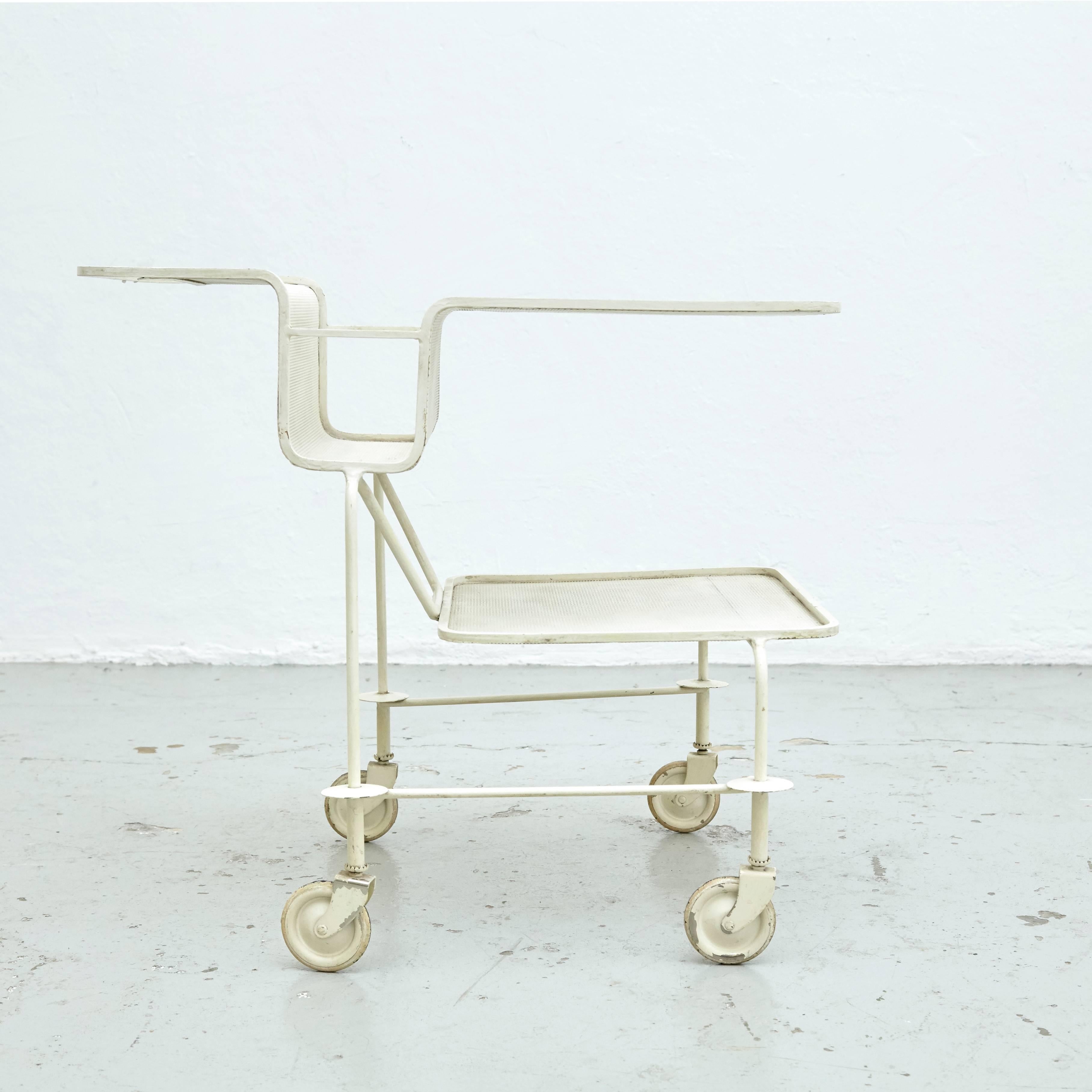 Trolley designed by Mathieu Matégot. 
Manufactured by Ateliers Matégot (France), circa 1950. 

Folded, perforated metal lacquered in white. 

In original condition, with minor wear consistent with age and use, preserving a beautiful patina,