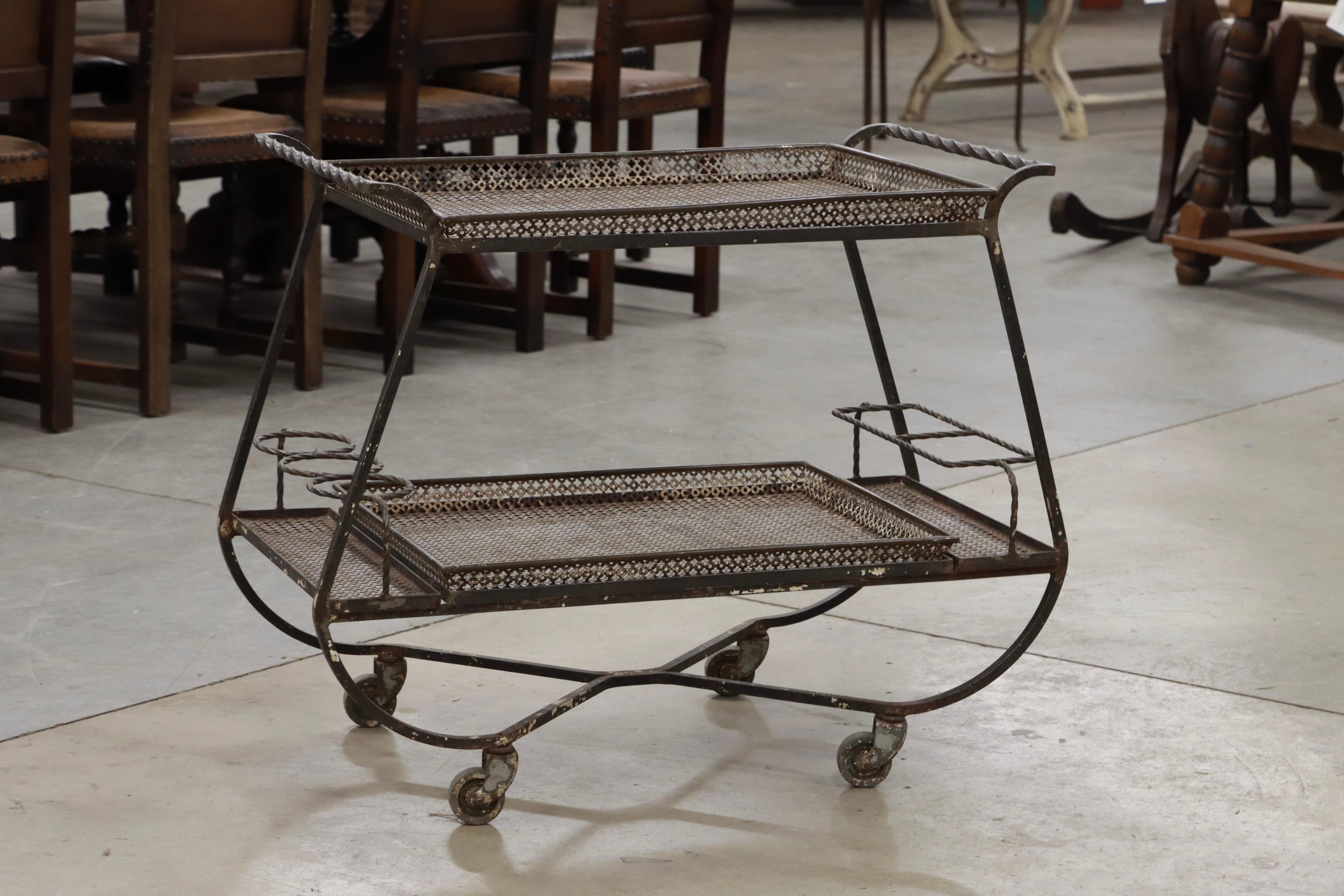 French Mid Century Mathieu Matégot stylish perforated mesh steel bar cart with removable trays on the top and bottom.  

Matégot was the creator of the pioneering and innovative Rigitulle method, integrating perforated metal with metal tubing.

He