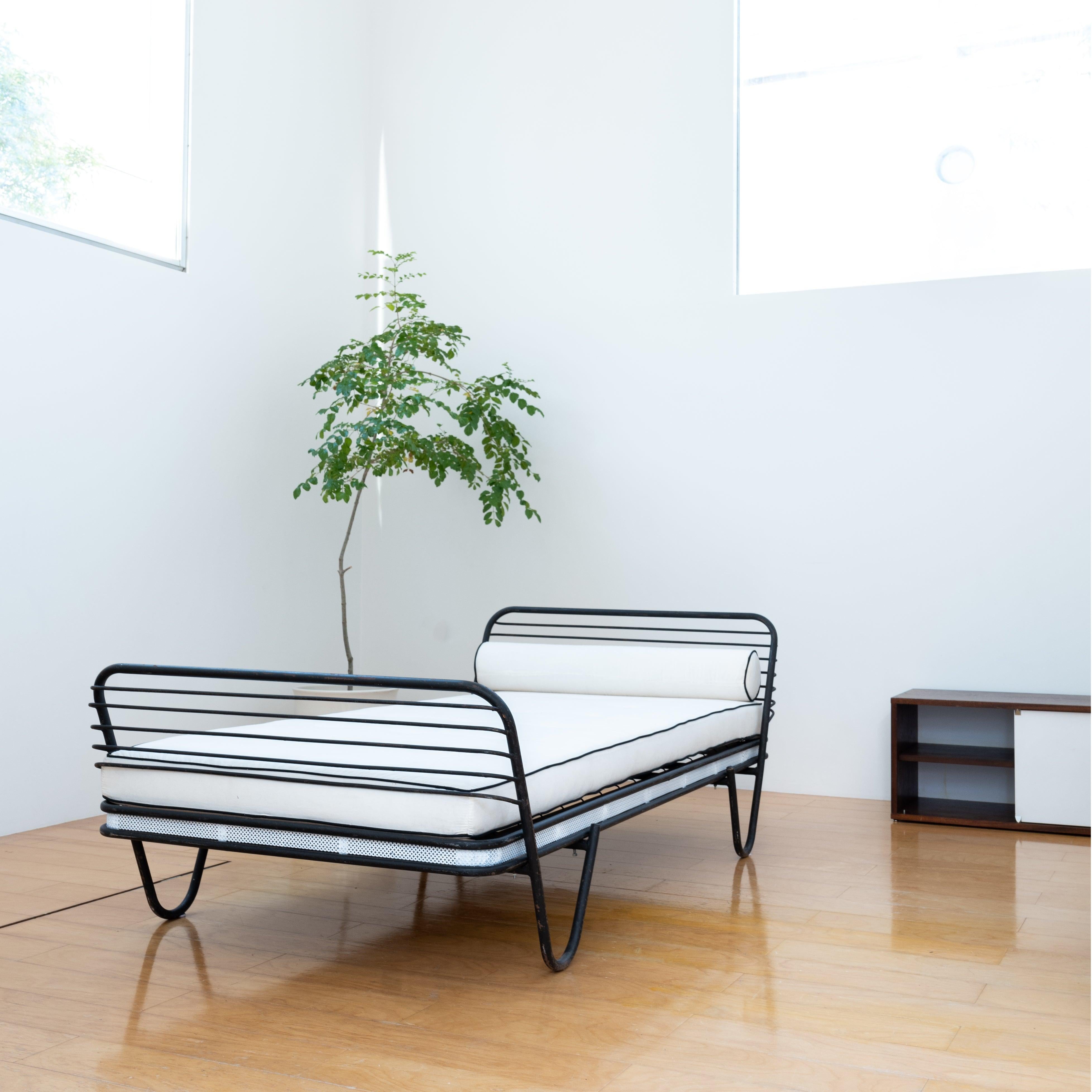 Mathieu Matégot's vintage daybed. The series name of the work is 'Kyoto'. In Mathieu Matégot's work it is a work of very rare value. Punch metal is accented on a thin frame.