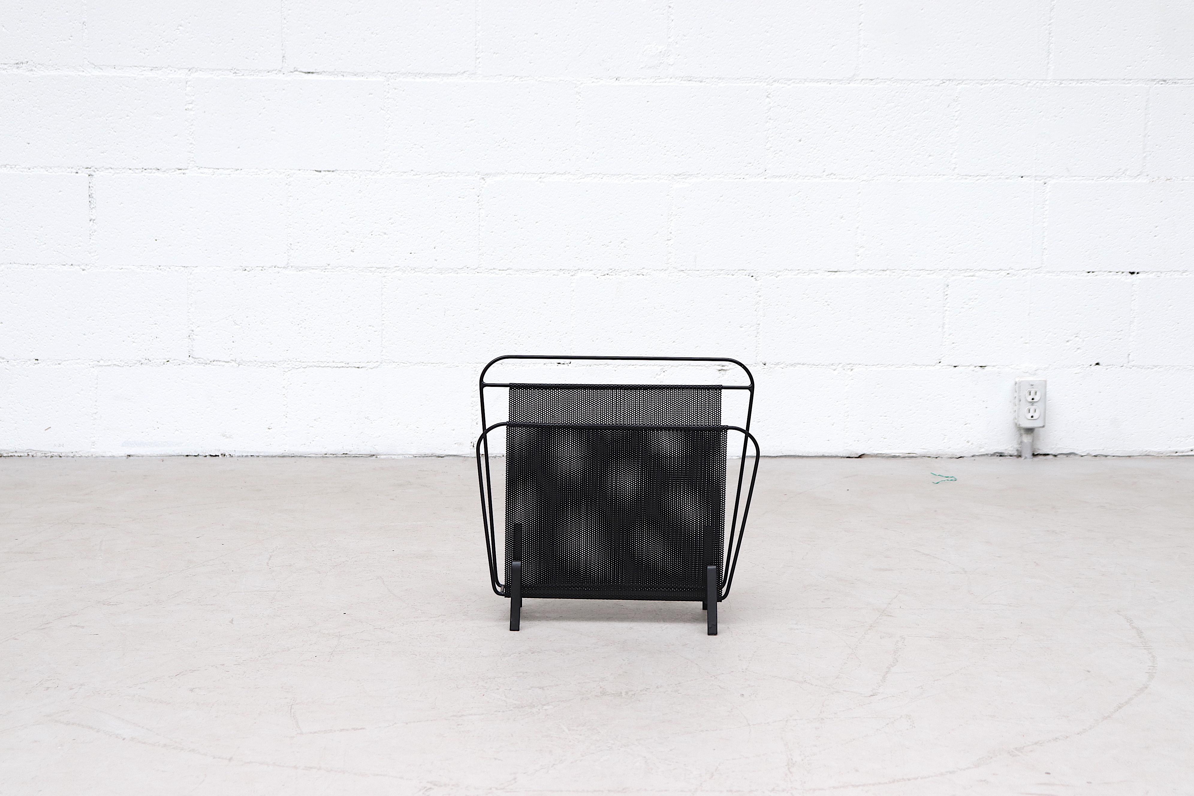 Mathieu Matégot attributed black enameled metal magazine rack for Artimeta Soest, 1960. In Very good original condition with minimal wear consistent to age and use.