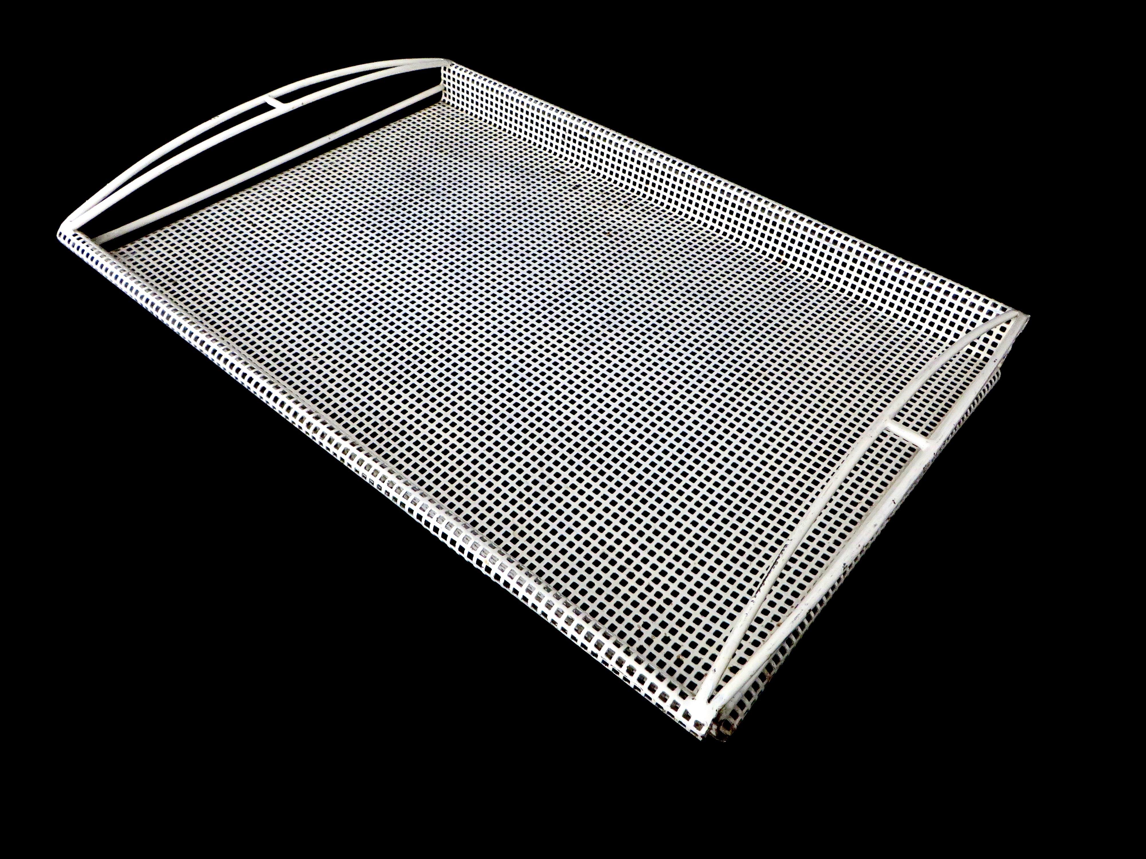 White metal tray, model Chamboard, designed by Mathieu Mategot, France, circa 1950.
Made of perforated sheet metal, a hole pattern on the tray, and two minimalistic handles. Manufactured in Ateliers Matégot, France, circa 1950.
The iconic