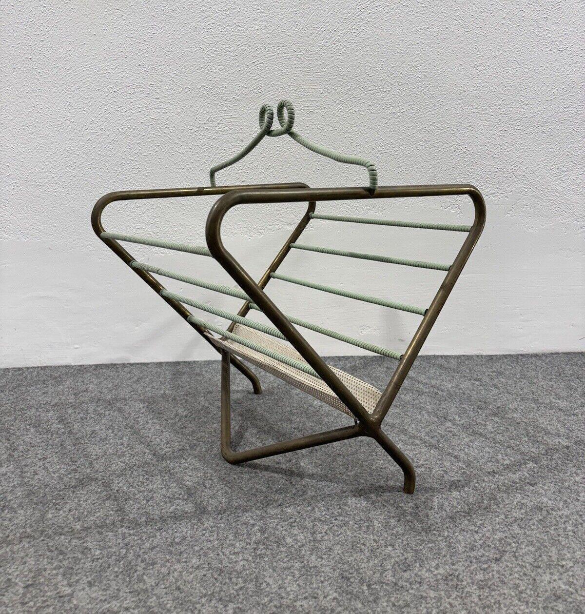 Mathieu Mategot Magazine rack Design Mid-century 1950's Modernism.

Brass frame, enameled metal, and plastic material.

Item in very good conservative condition, no cosmetic or structural defects to report, only slight and obvious signs of time due