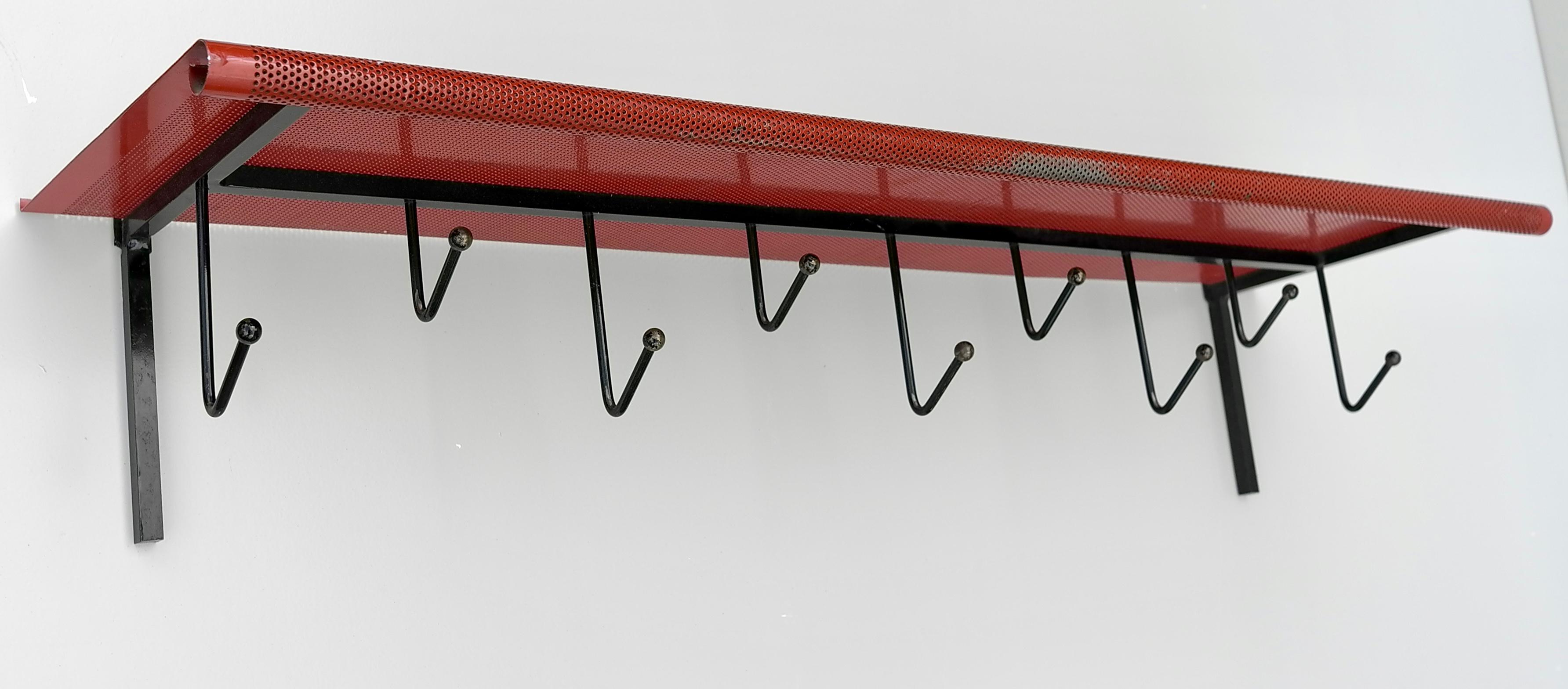 Mathieu Matégot black and Red coat rack for Artimeta the Netherlands 1950s.
Painted black and Red metal with brass ball ends each hook. In very good vintage condition, all original paint.

Documented in the Artimeta catalog.

