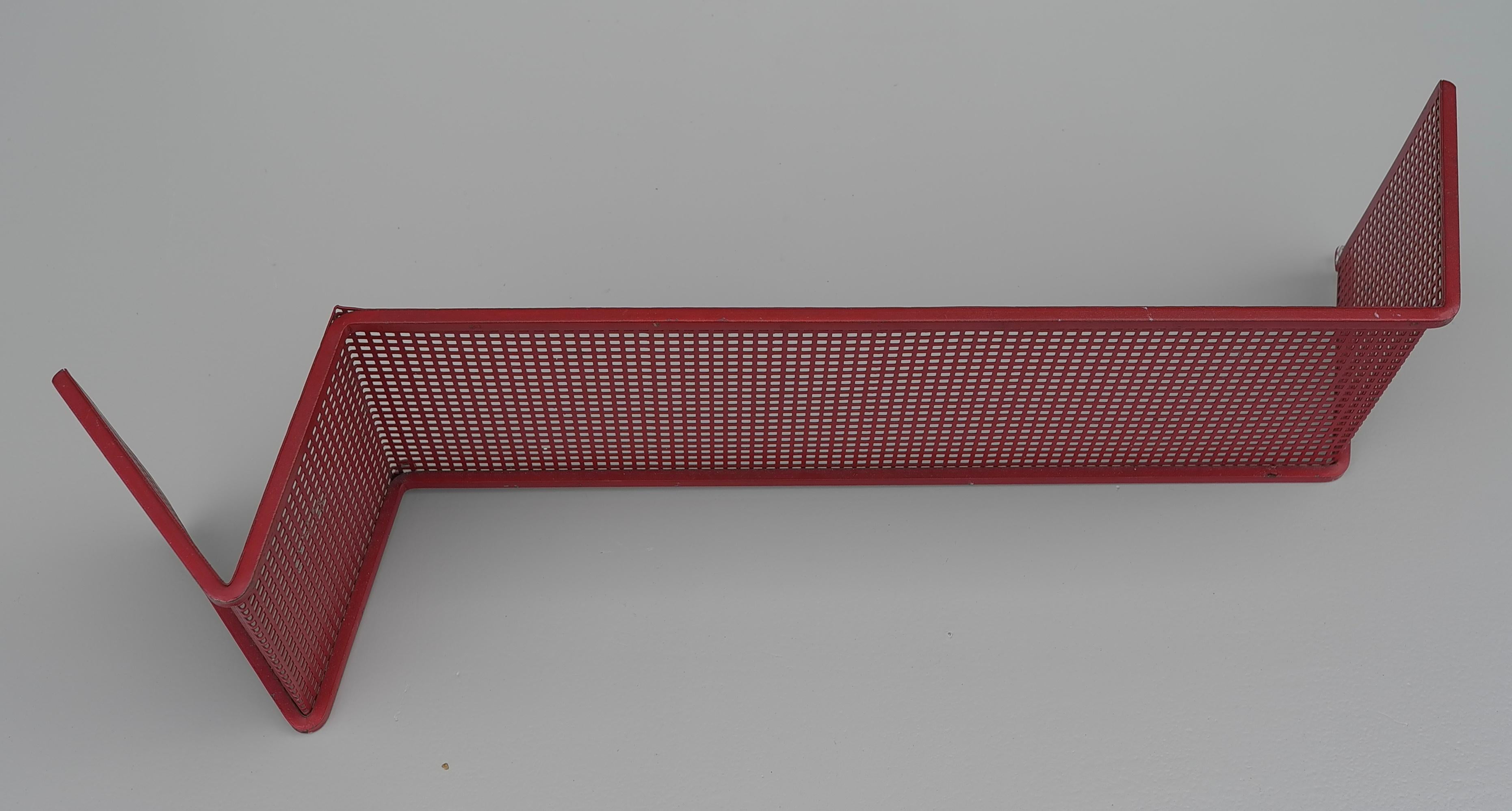 Designed by Mathieu Matégot.  Red metal perforated shelve. Manufactured by Artimeta The Netherlands in the 1950's