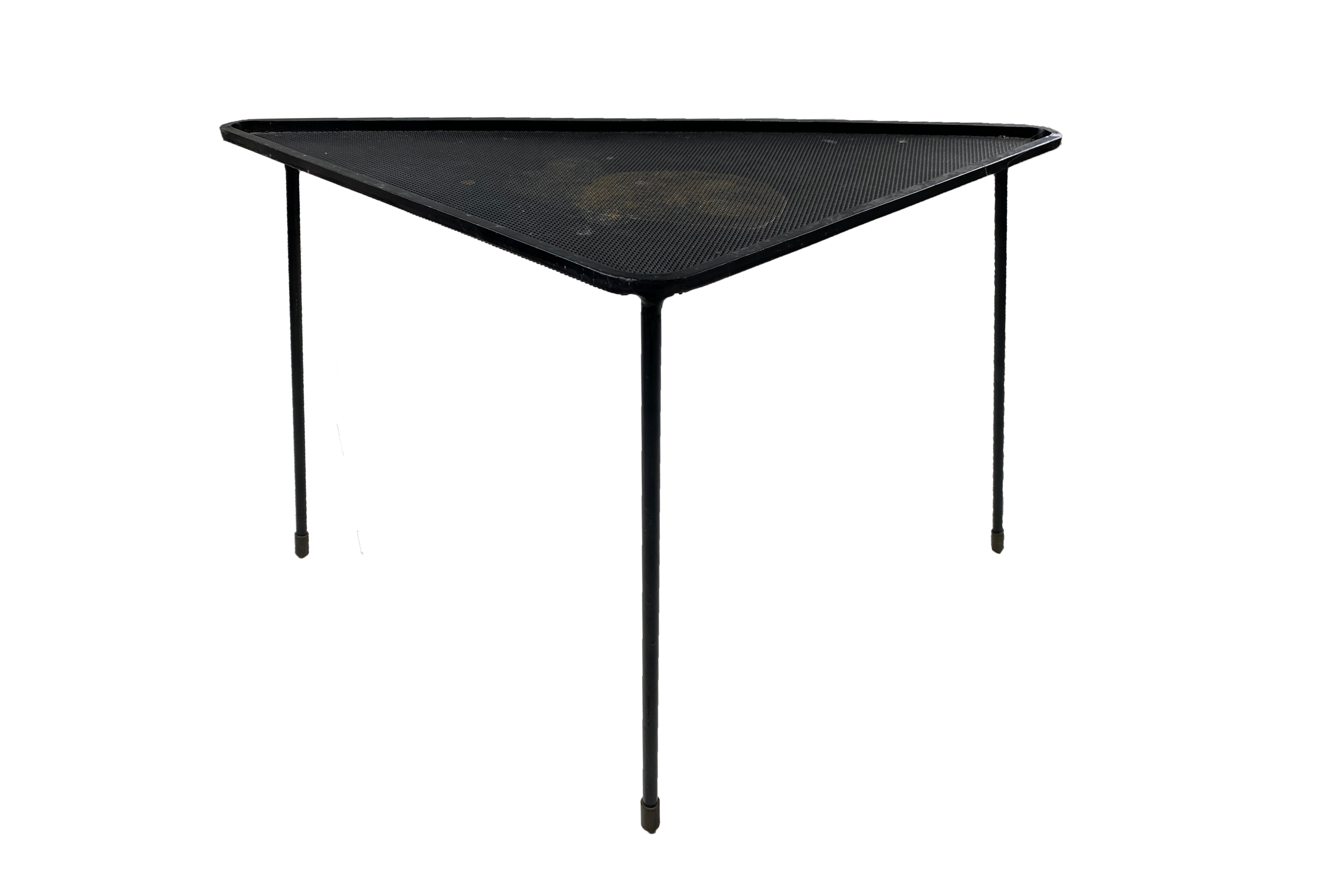 Mathieu Matégot triangle side table.
Made with lacquered performated metal.
Circa 1950, France.
Very good vintage condition.
Matégot was born on 4 April 1910 at Tápió-Sully, a village about 20 kilometres (12 mi) from Budapest in Hungary. He