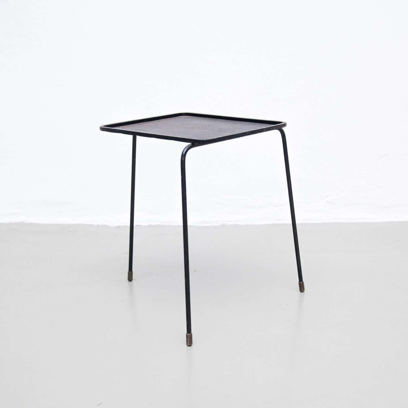 Soumba coffee and side table designed by Mathieu Matégot.
Manufactured in France, circa 1950.
Black lacquered Metal.

In good condition, with minor wear consistent with age and use, preserving a beautiful patina.

Mathieu Matégot (1910-2001)