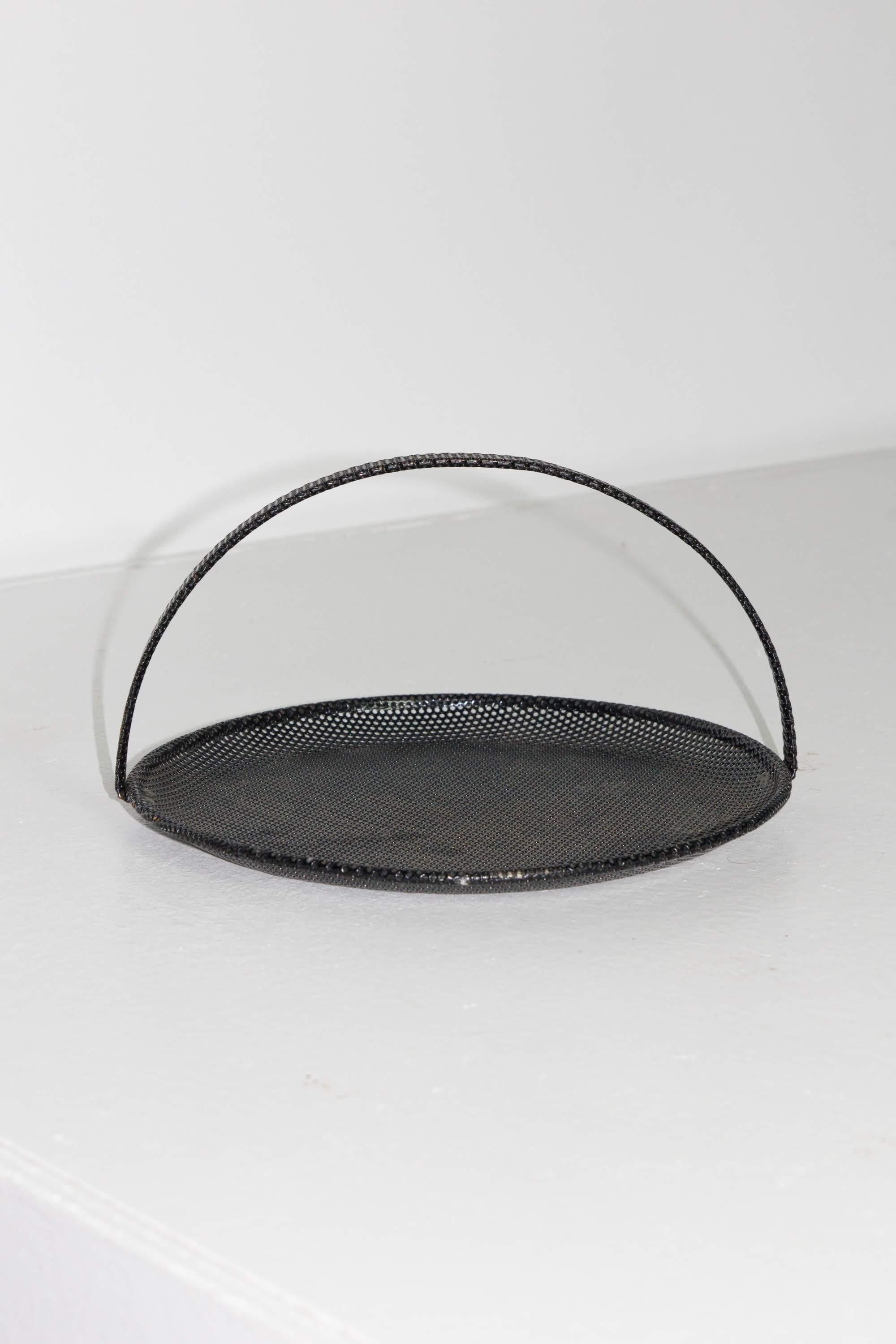 Black perforated metal tray with handle designed by Mathieu Matégot for Artimeta.