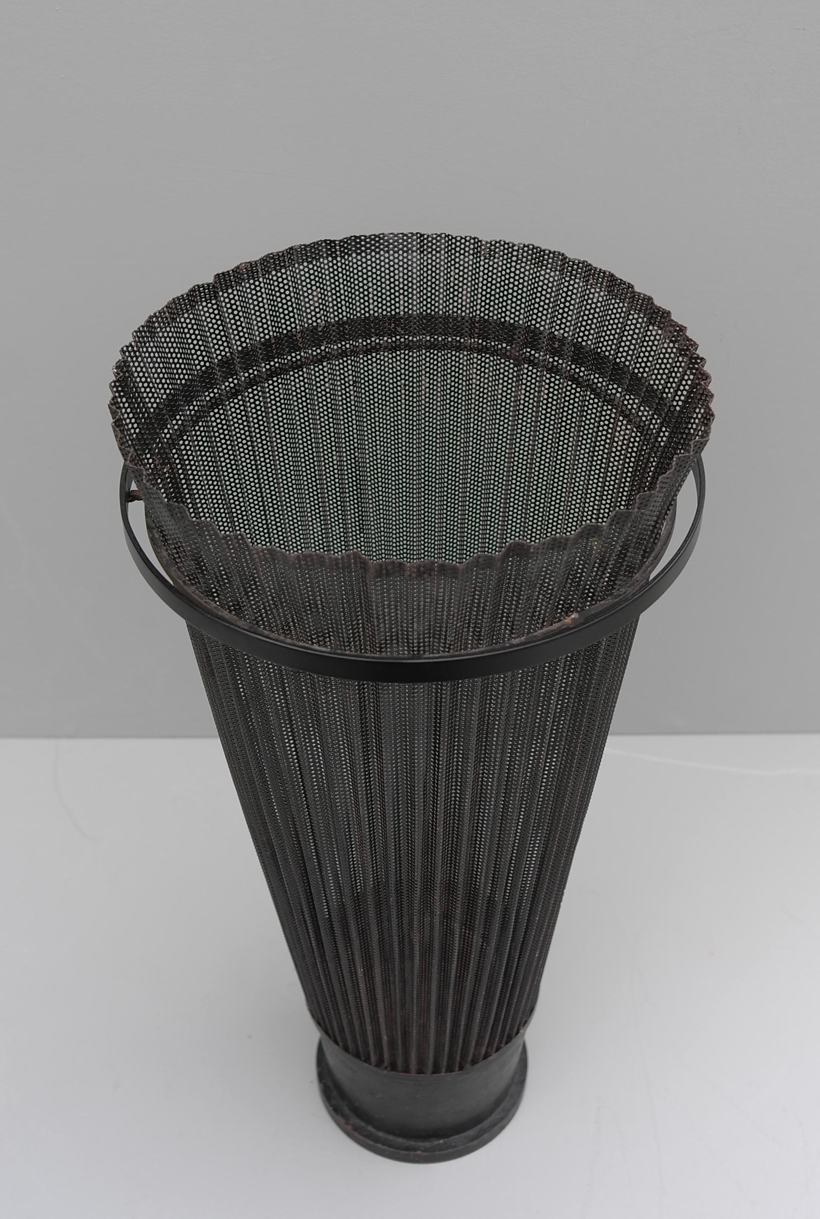 Rare Mathieu Matégot umbrella stand black Rigitulle, Atelier Matégot, France, 1950s.