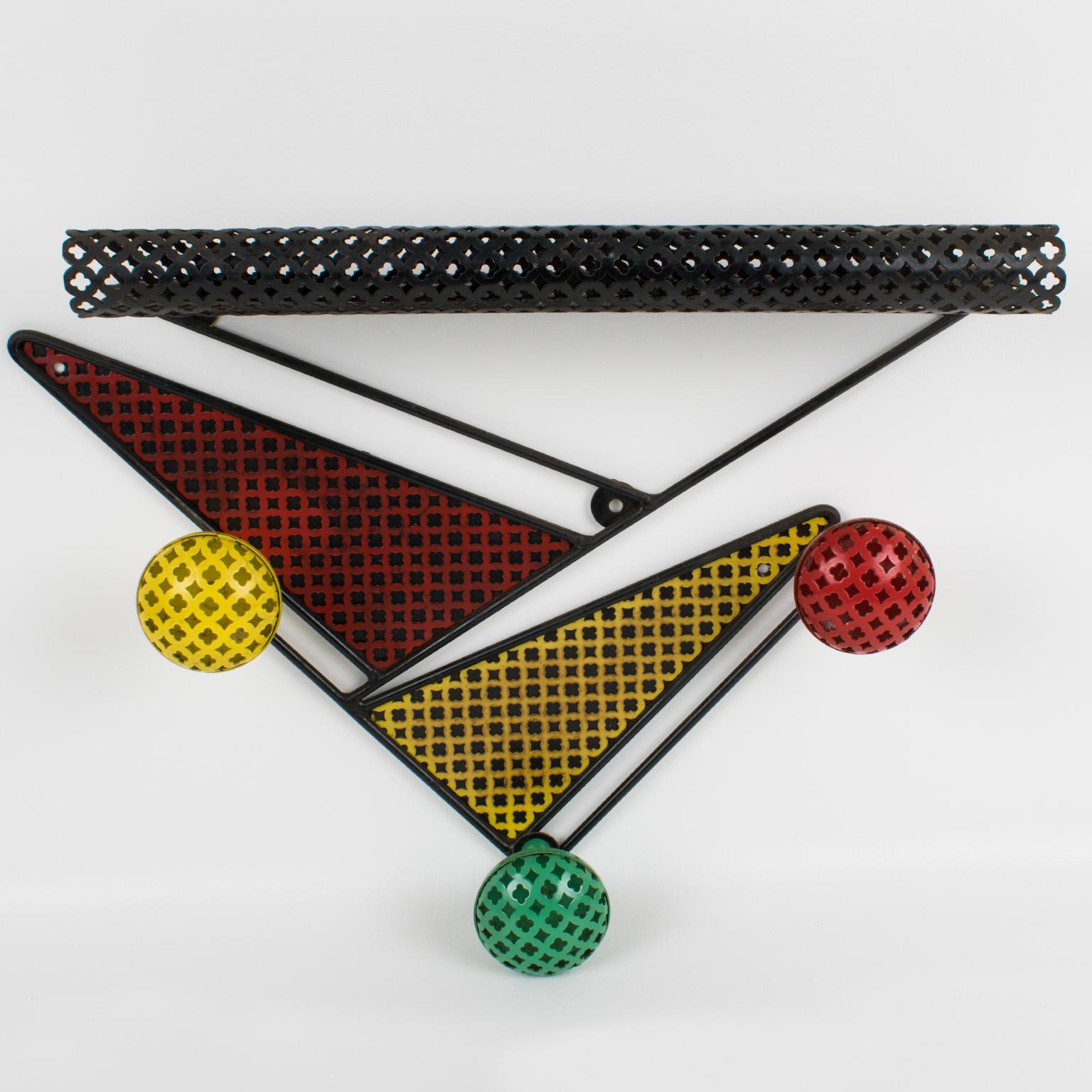 A colorful metal coat rack or hanger with hat stand by French designer Mathieu Mategot (1910 - 2001) from the 1950s. Wall mount black metal frame with 