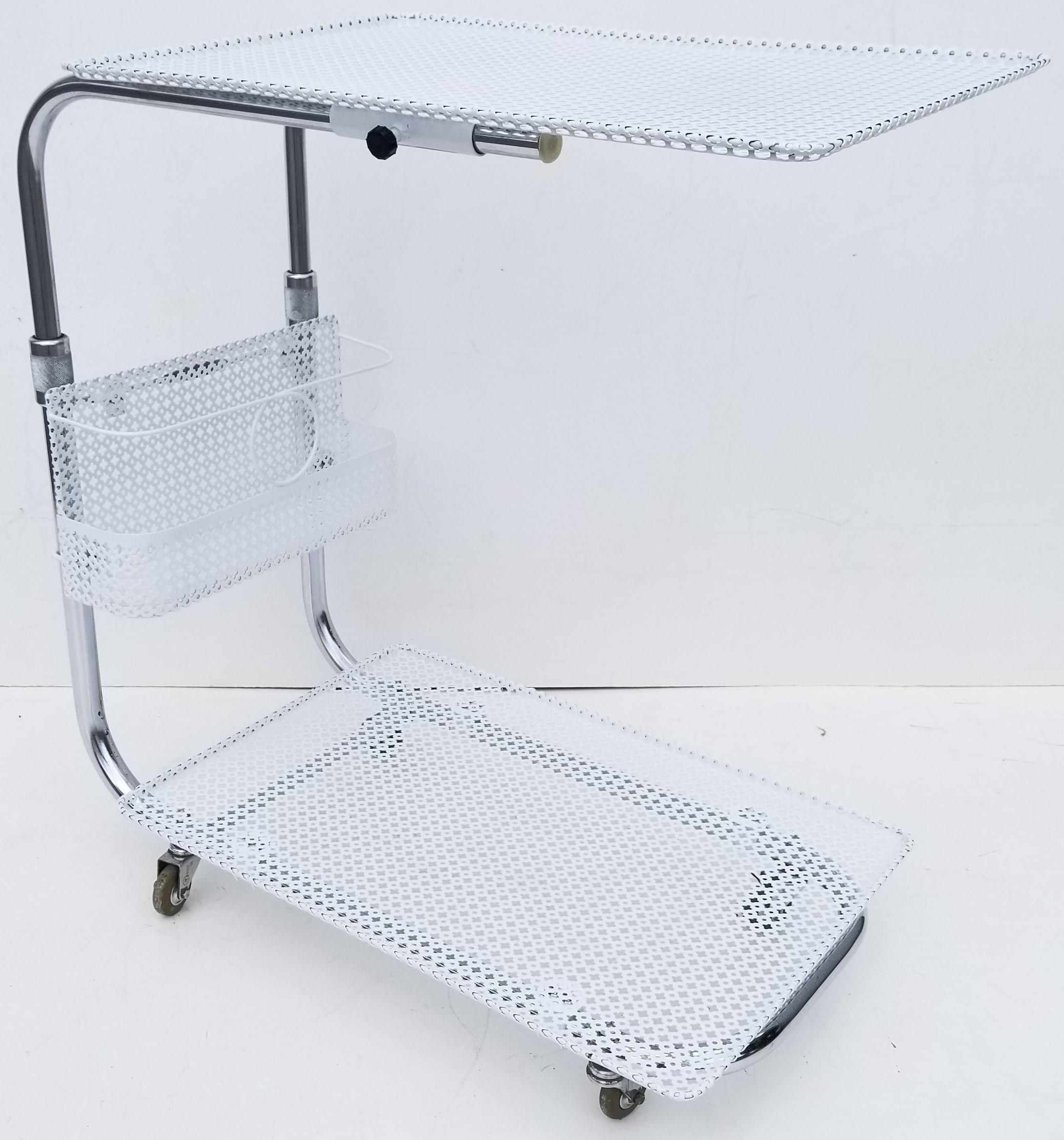 French Mid-Century Modern Bar Cart, Serving Cart by Mathieu Matégot, L'adapt-bar, signed and numbered. 
Features a polished Steel Frame with 2 tier fine wire mesh Tray and comes with a bottle Holder.
On all original Casters which run
