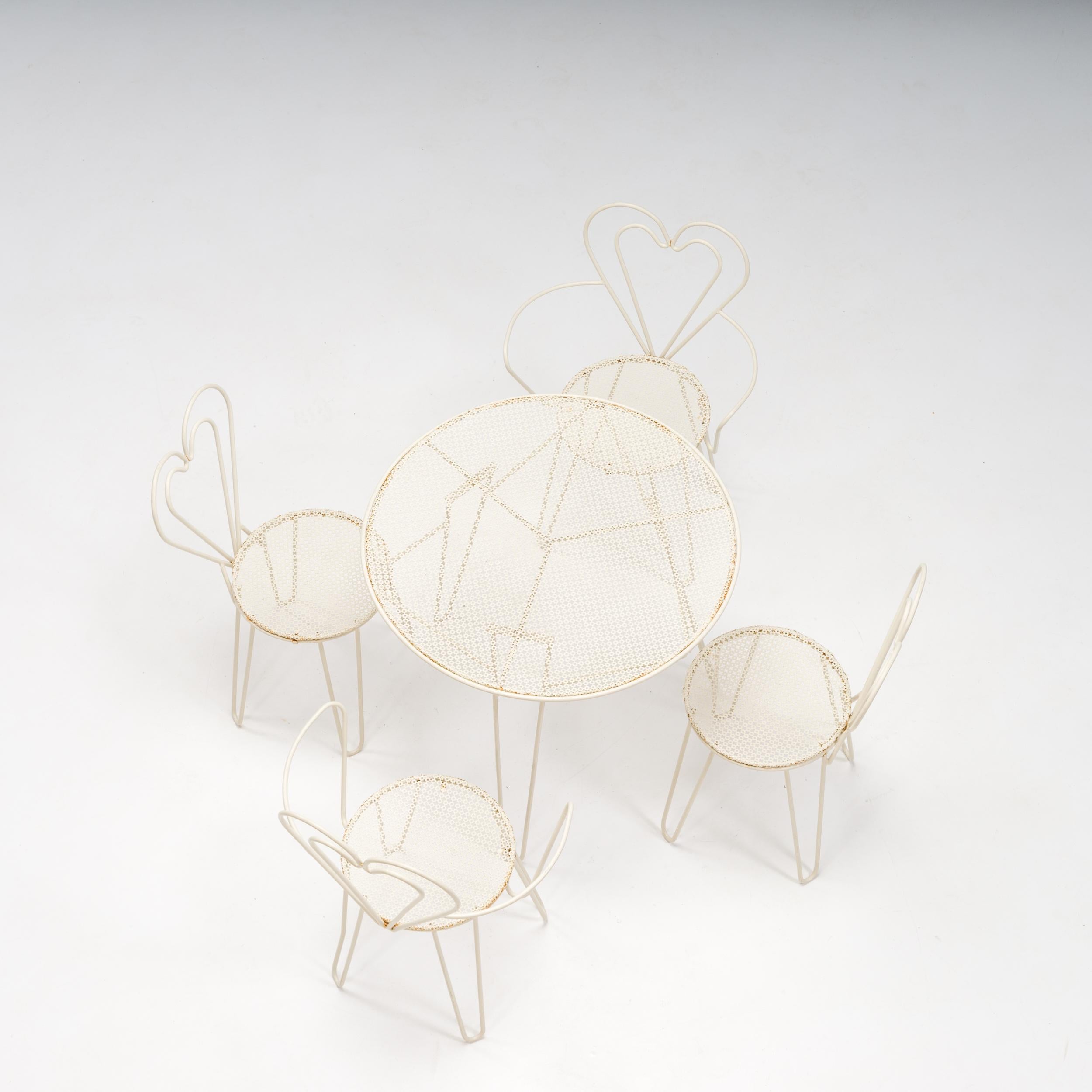 One of the most renowned French designers of the 1950s, Mathieu Matégot was famous for his work with metal, and his garden furniture remains highly collectible.

Comprising a round table and four chairs, this garden set is constructed from tubular