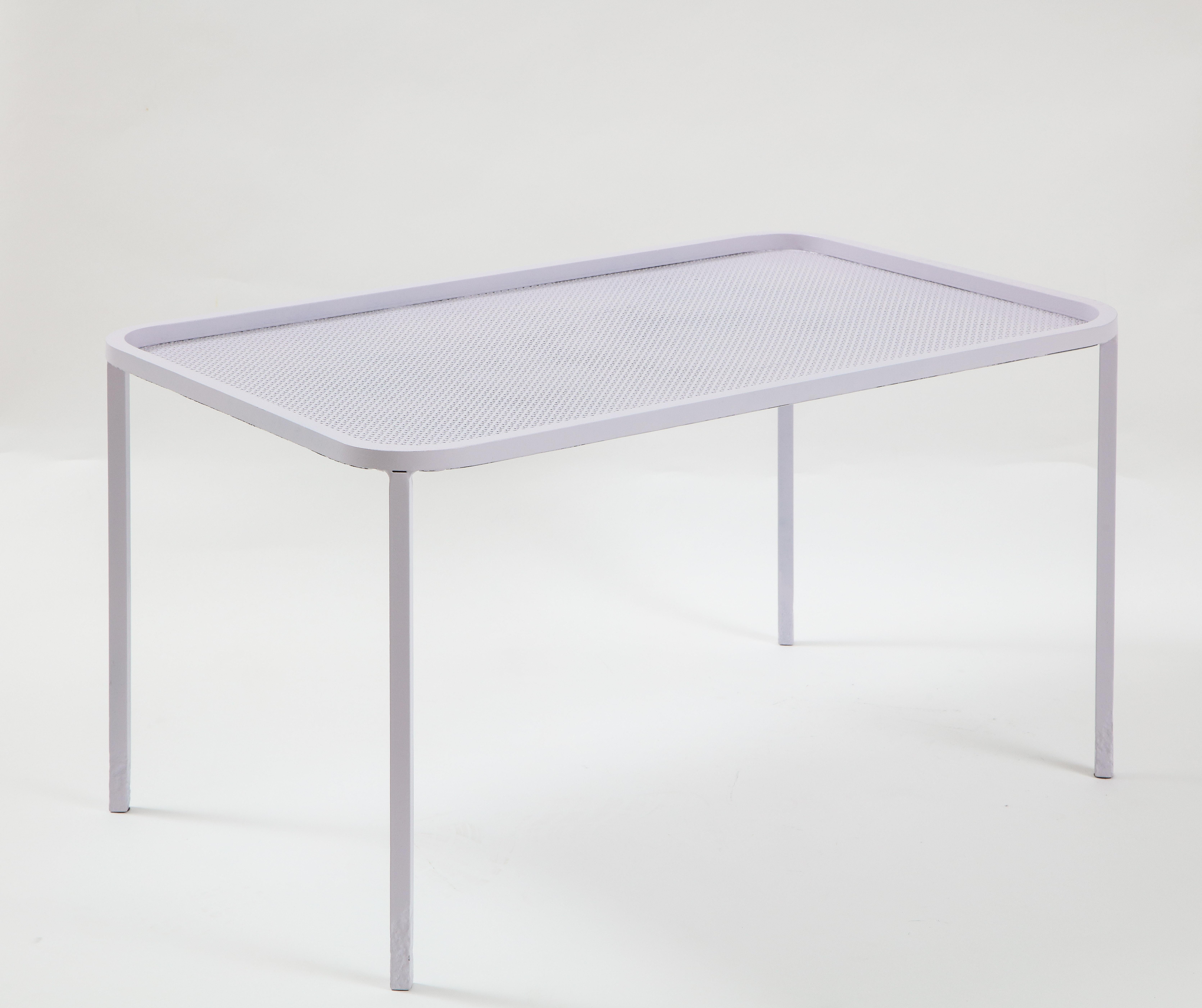 Mathieu Matégot white rectangular perforated metal coffee table, France, mid-20th century

Simple yet elegant design consists of a perforated metal table top, clean curvilinear edge, and sleek legs. This table has refinished and is in fantastic