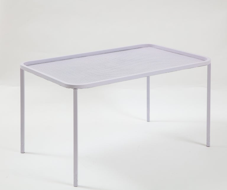 Mathieu Matégot white rectangular perforated metal coffee table, France, mid-20th century

Simple yet elegant design consists of a perforated metal table top, clean curvilinear edge, and sleek legs. This table has refinished and is in fantastic