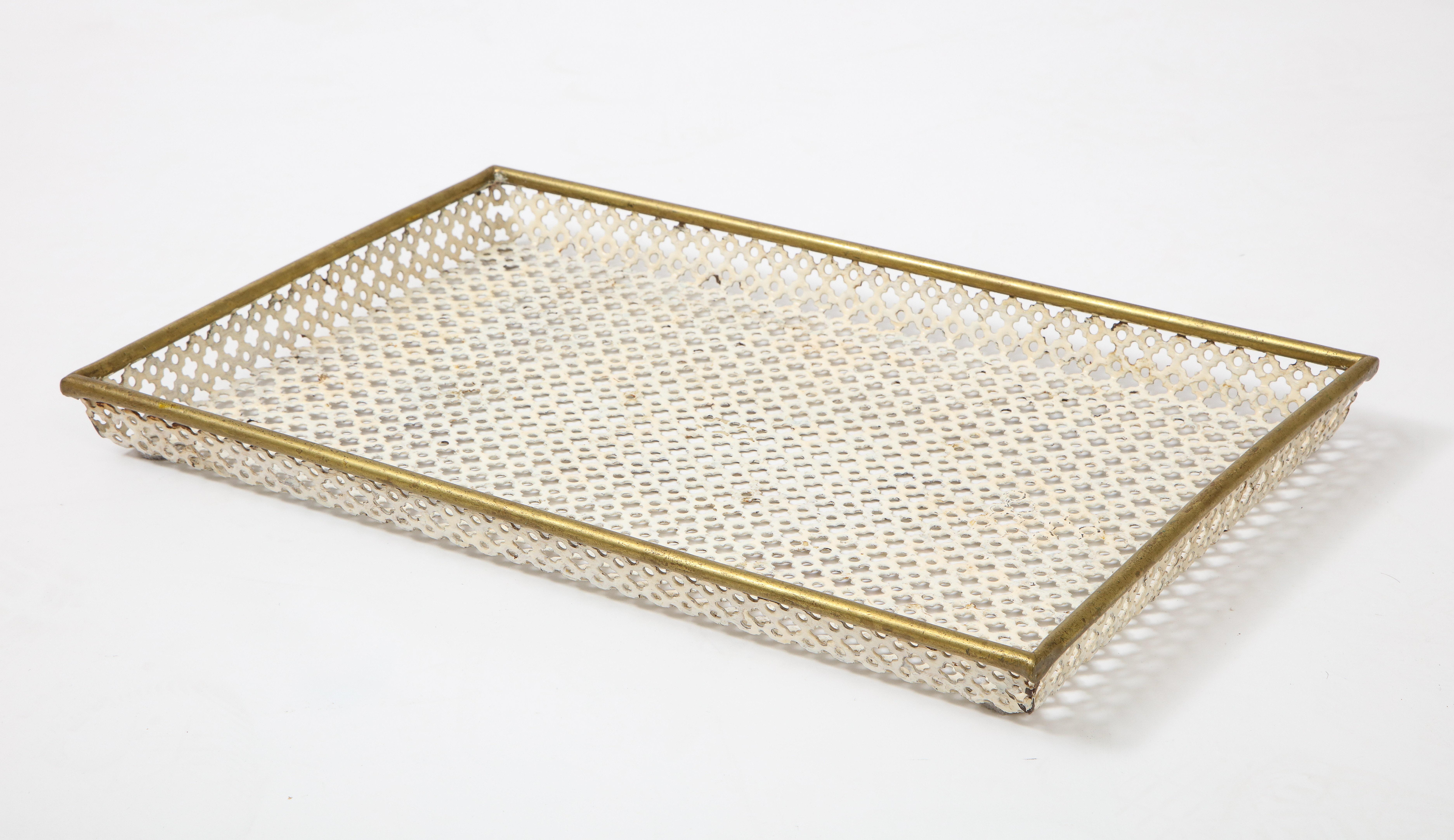 Mathieu Matégot (1910-2001)
White tray, France, circa 1950
Perforated metal, brass rod detail, enamel
Measures: H 1.5, D 11.5, W 17.25 in.

Provenance: Collection of an architect, France

Bibliography: JOUSSE ENTREPRISE, 