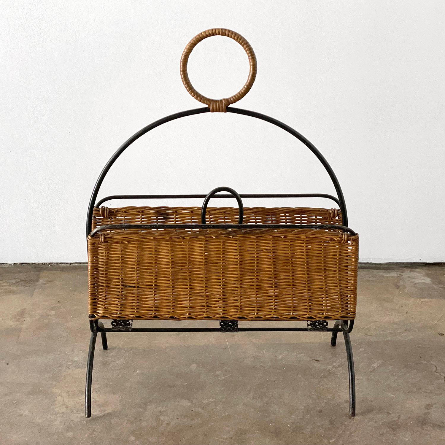 Mathieu Matégot wicker and iron magazine rack
Hand woven handle
Signature perforated metal detail
Sculptural design
Natural color variations in the wicker
Patina from age and use
Newly reconditioned.