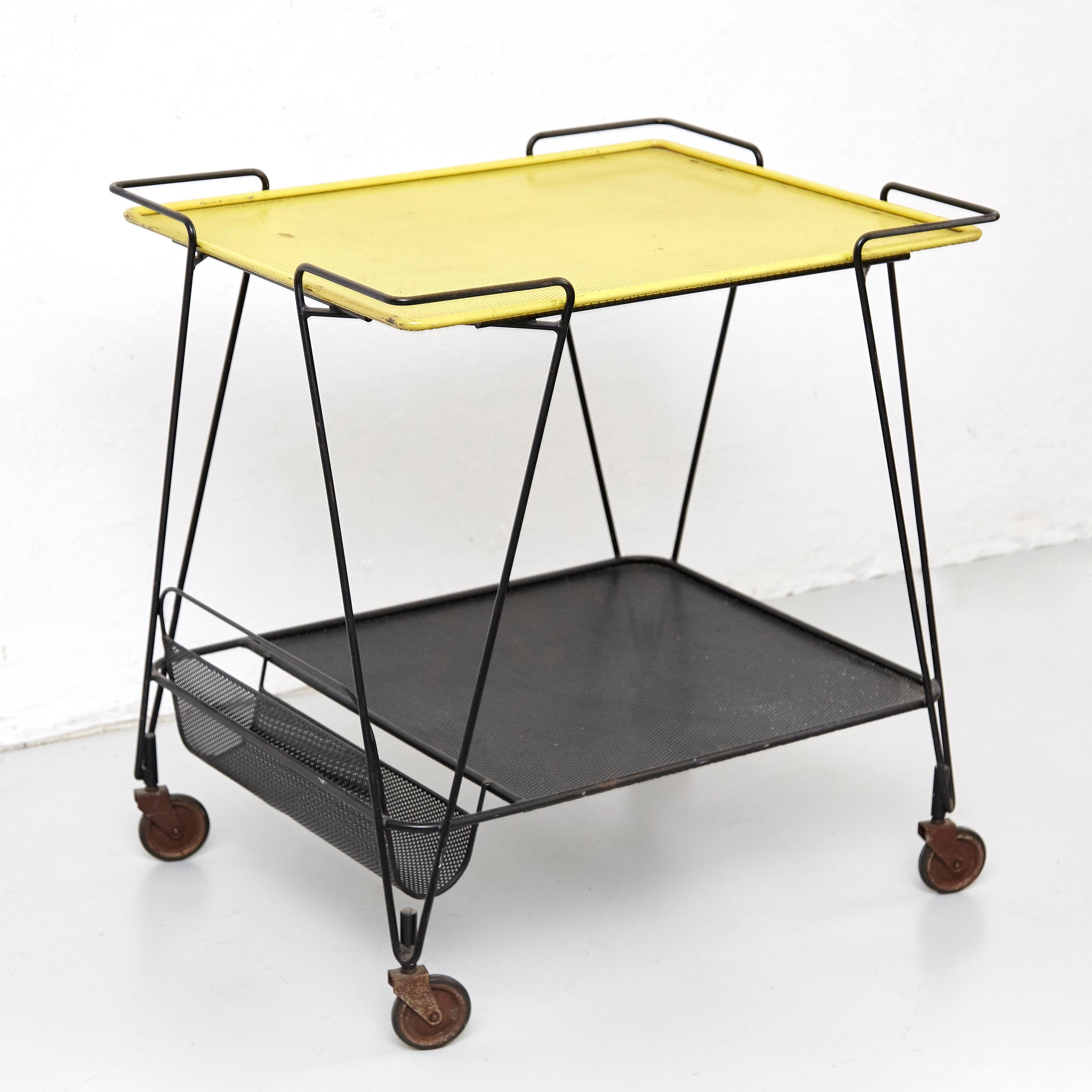 Trolley designed by Mathieu Matégot.
Manufactured by Ateliers Matégot (France), circa 1950.
Folded, perforated metal lacquered in black.

In good original condition, with minor wear consistent with age and use, preserving a beautiful patina,