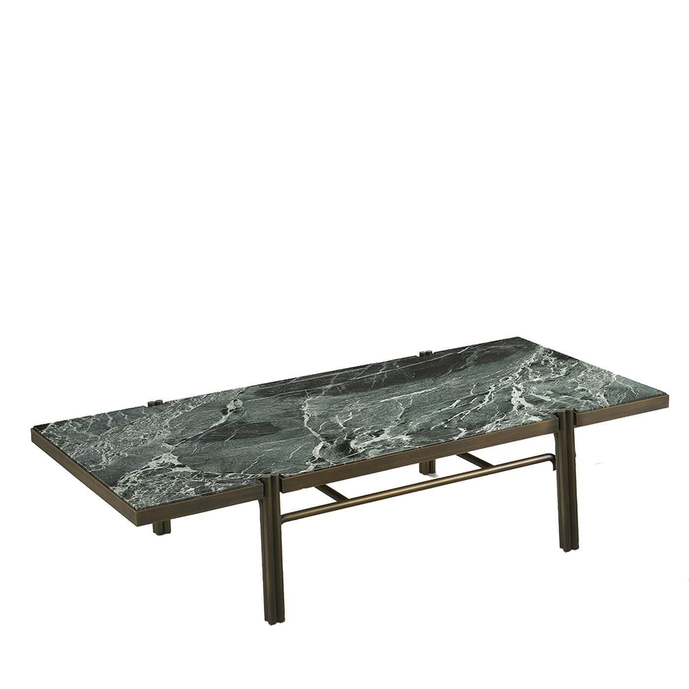 Part of a two-piece series, this coffee table is modern and sophisticated. Its rectangular top in Green St. Denis marble (2 cm thick) is mounted on a frame in metal with a black finish. This frame and the lustrous finish are also present in the