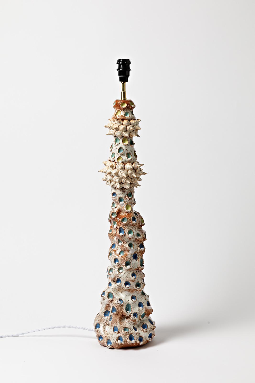 Mathilde Sauce

Unique piece, realised in 2021

Large stoneware ceramic table lamp

Blue, orange and white ceramic glazes colors

Electrical system is new

Signed under the base

Ceramic measures - height : 60 cm Large : 16 cm
Measures