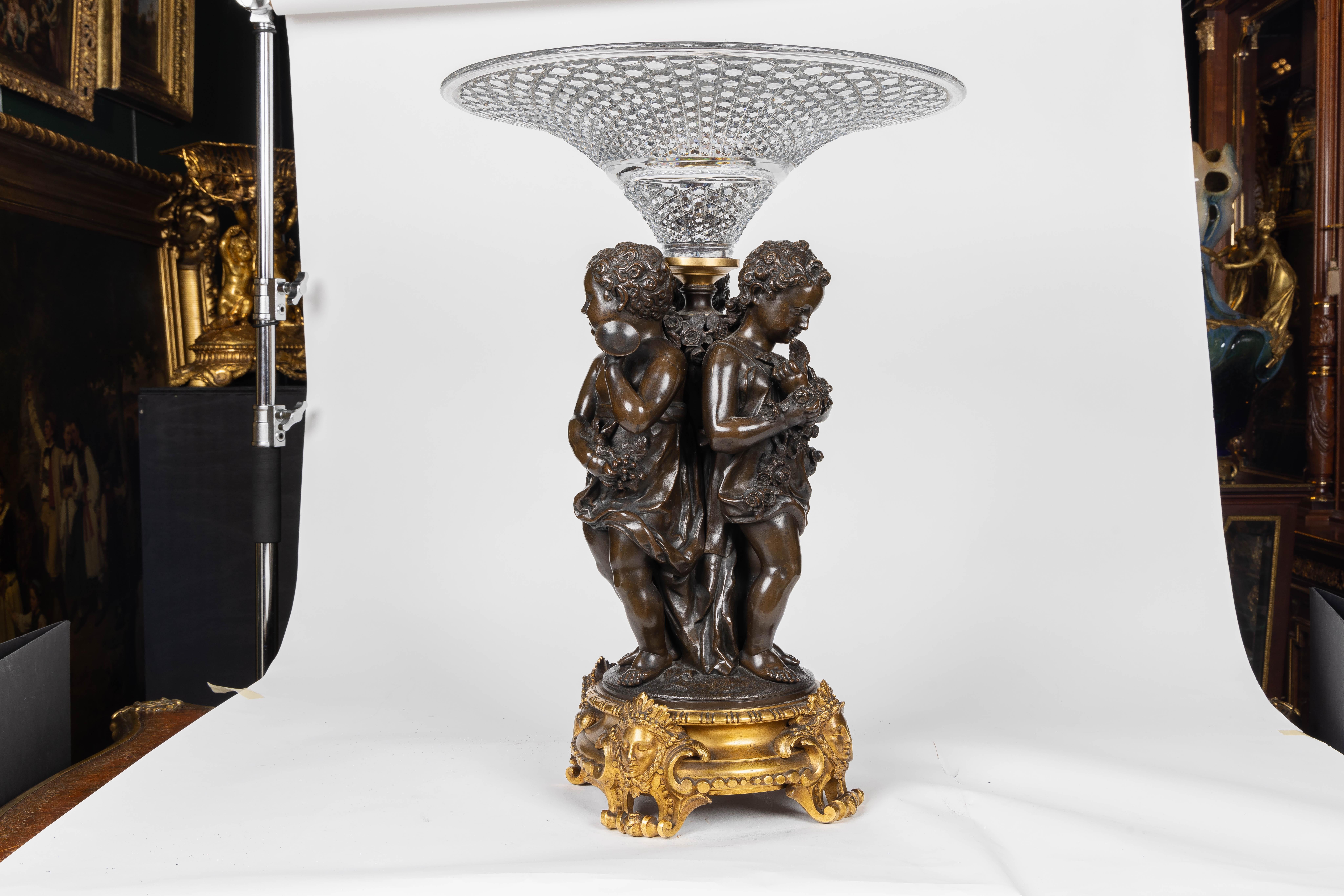 Mathurin Moreau (French, 1822-1912)

A Monumental French Bronze and Crystal Figural Centerpiece

Introducing an extraordinary and monumental French gilt and patinated bronze and crystal figural centerpiece by Mathurin Moreau, mounted on an exquisite