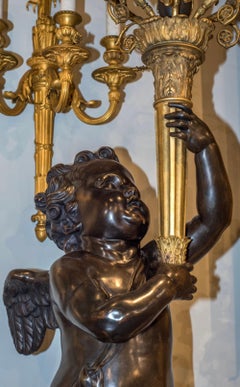 A Pair of Important Gilt and Patinated Bronze Putti Torchères