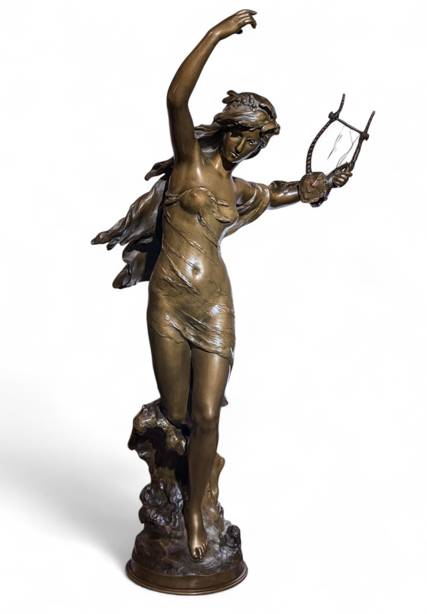 Mathurin Moreau (French, 1855-1919)

Bronze female figure titled Danseuse a La Lyre, The Lyre Dancer.  A patinated maiden posed holding a lyre with a tortoise shell accent in her raised left hand. 

Signed and impressed with Medaille d'Honneur