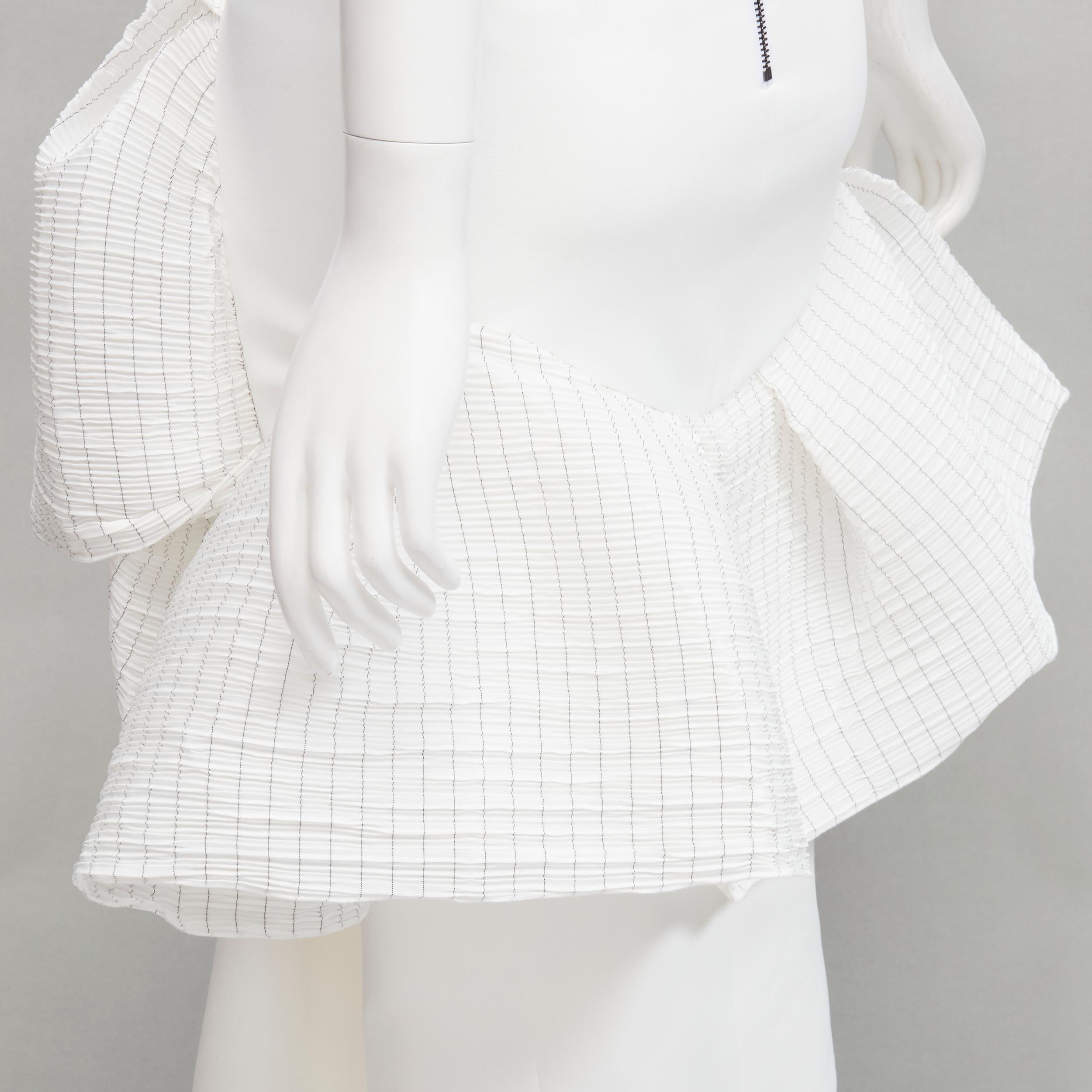 MATICEVSKI 2021 Emblazon Ruffle white pleated check peplum skirt AUS6 S
Reference: AAWC/A00355
Brand: Maticevski
Collection: 2021
Material: Polyester
Color: White
Pattern: Solid
Closure: Zip
Lining:  Fabric
Extra Details: Back zip detail.
Made in: