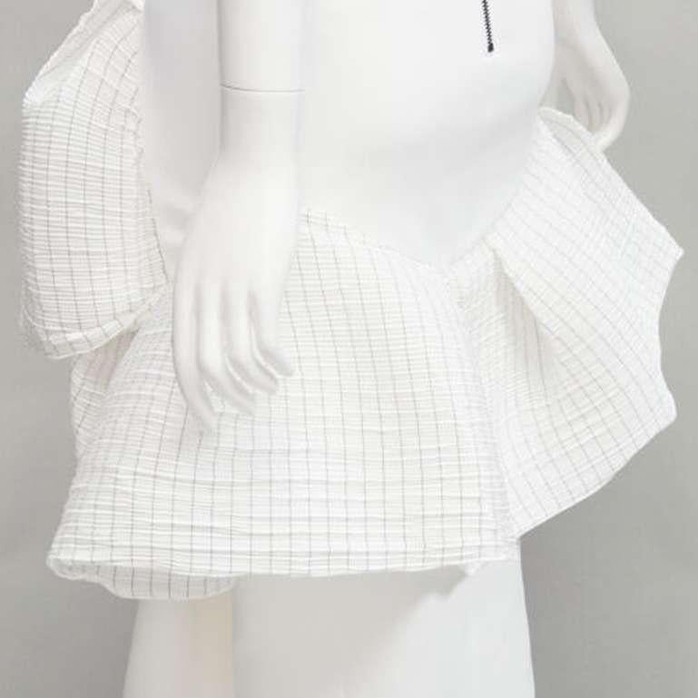 MATICEVSKI 2021 Emblazon Ruffle white pleated check peplum skirt AUS6 S
Reference: AAWC/A00355
Brand: Maticevski
Collection: 2021
Material: Polyester
Color: White
Pattern: Solid
Closure: Zip
Lining: Fabric
Extra Details: Back zip detail.
Made in:
