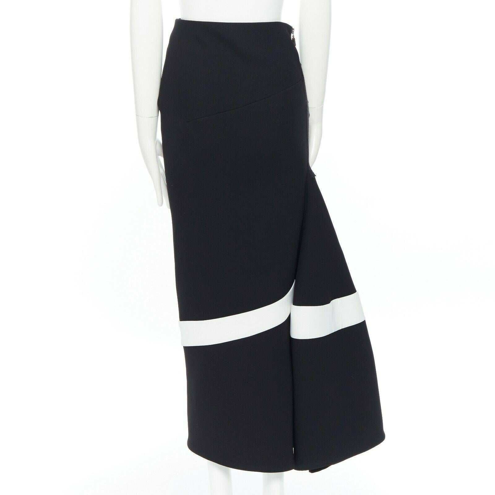 MATICEVSKI black white asymmetric architectural trumpet midi skirt train AU6 Reference: LNKO/A01111 
Brand: Maticevski 
Collection: Fall Winter 2015 
Material: Polyester 
Color: Black 
Pattern: Striped 
Closure: Zip 
Extra Detail: Asymmetrical