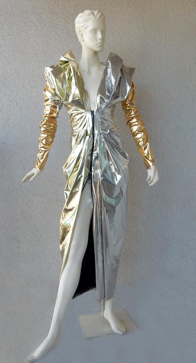 Toni Maticevski's futuristic dress, aptly named “Stargazer”, offers drama and excitement in the world of fashion.   Boasts tucked sleeves  with a gold and silver metallic foil finish. Features front zip closure. Very Mugler-like.

Size: us 6, uk 10;