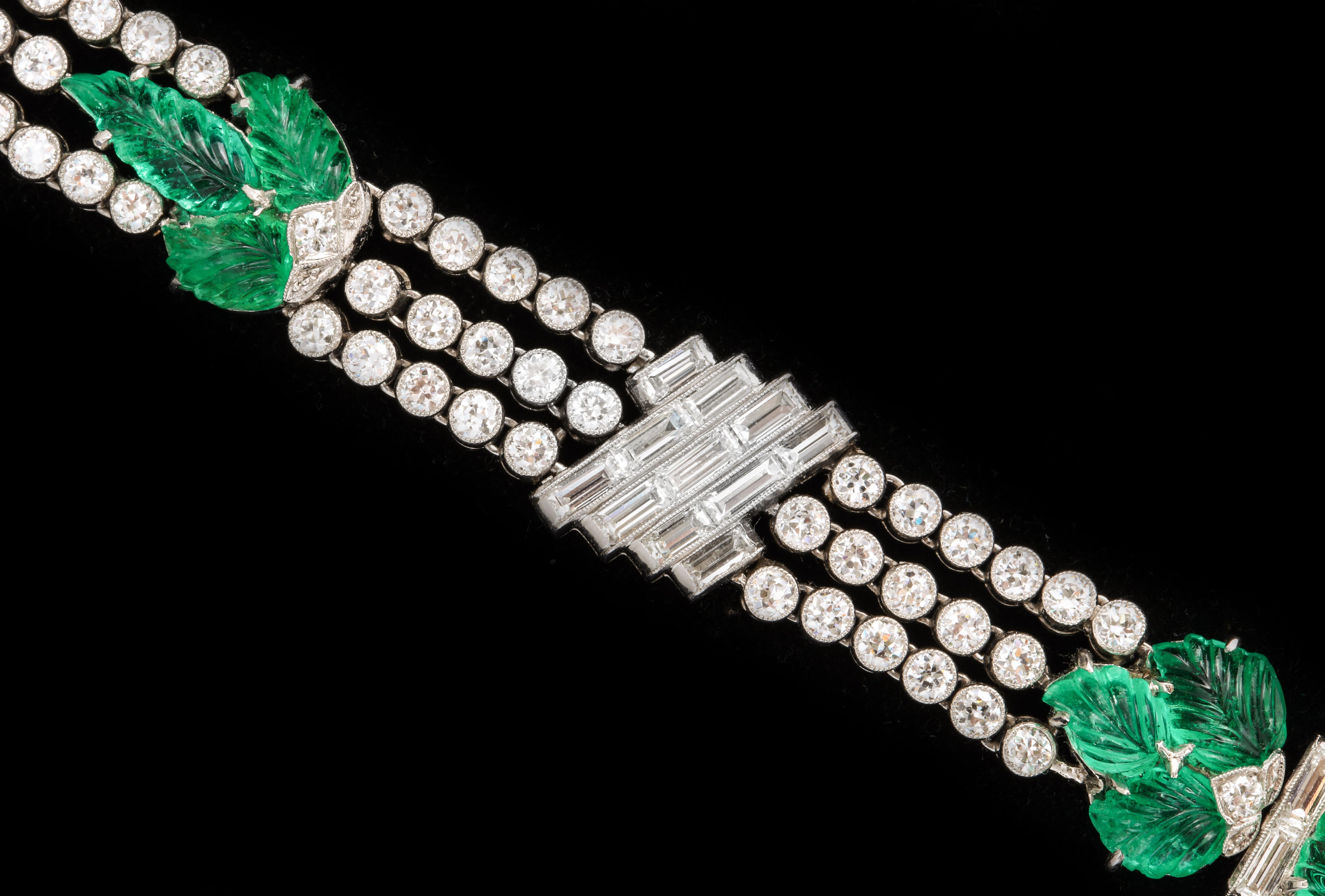 A flexible bracelet with emeralds carved to a leaf design underscored by round and baguette diamonds (approximately 9 carats) circa 1930. 

Provenance:

1. From the collection of Matilda Dodge Wilson

2. Depicted in full page spread in the 