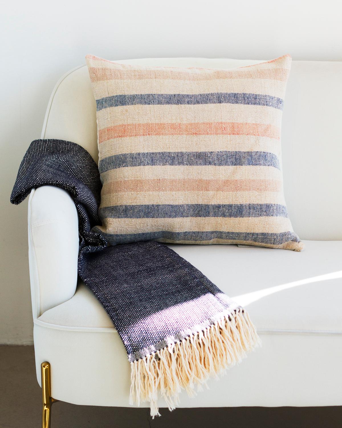 One of a kind vintage linen throw pillows to beautify your home
A hundred years ago these fabrics used to be cereal sacks in Northern Portugal. Now they get rediscovered and transformed into a rare collectible.
 
This Matilde Blue and Pink Stripe