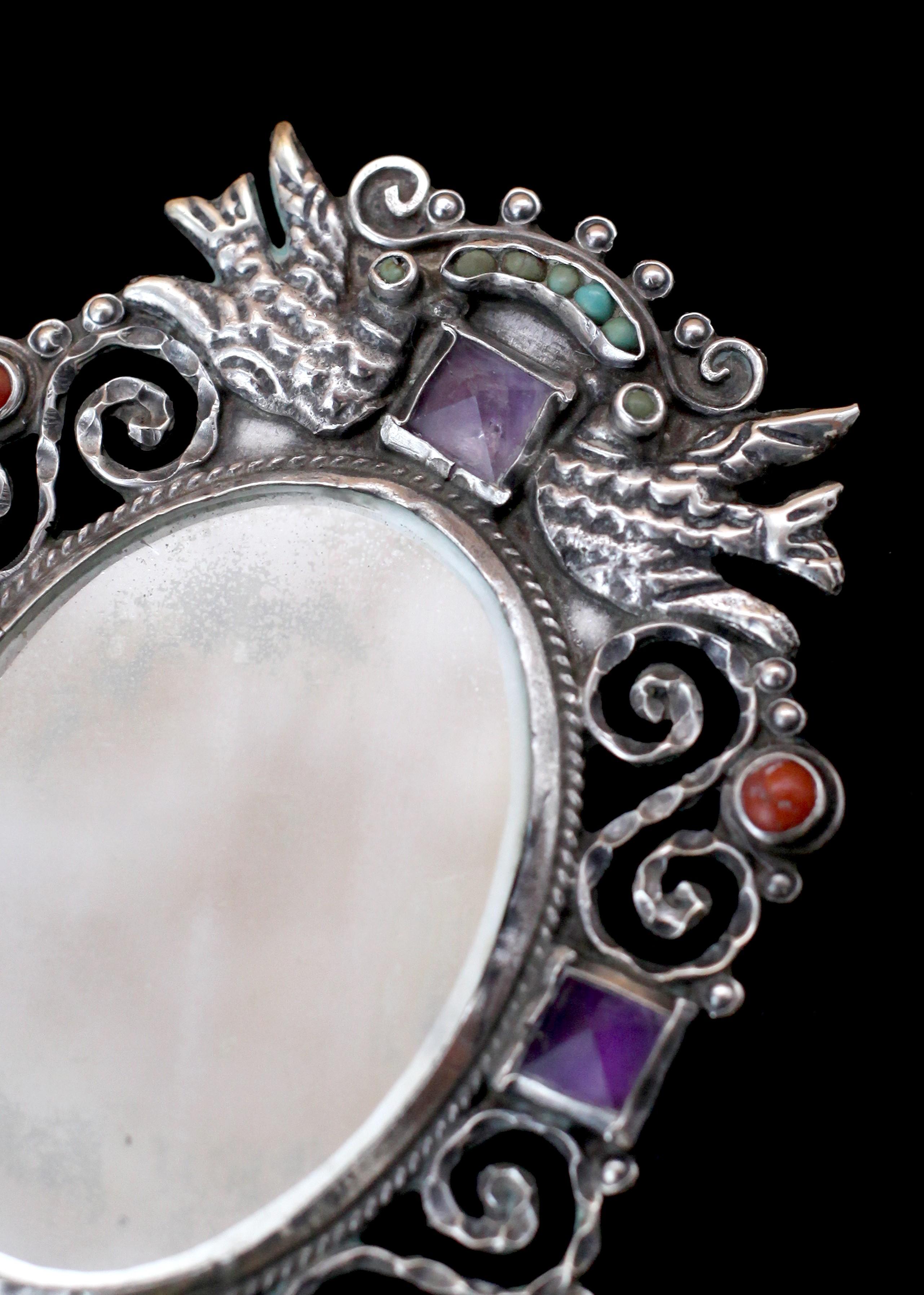 Prepare to be mesmerized in the dance of light on sterling and gems in this Matilde Poulat Gem-set Sterling Mirror. With plenty of artistry to devour, you'll get lost as you gaze into this sterling mirror. Adorned with gem inlays, it doesn't just
