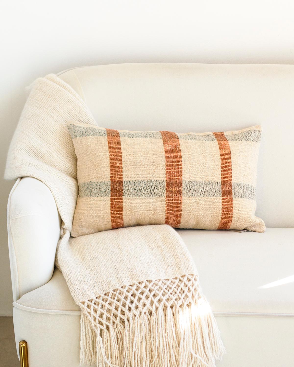 One of a kind vintage linen throw pillows to beautify your home

A hundred years ago these fabrics used to be cereal sacks in Northern Portugal. Now they get rediscovered and transformed into a rare collectible. This Matilde Siena and Navy Checkered