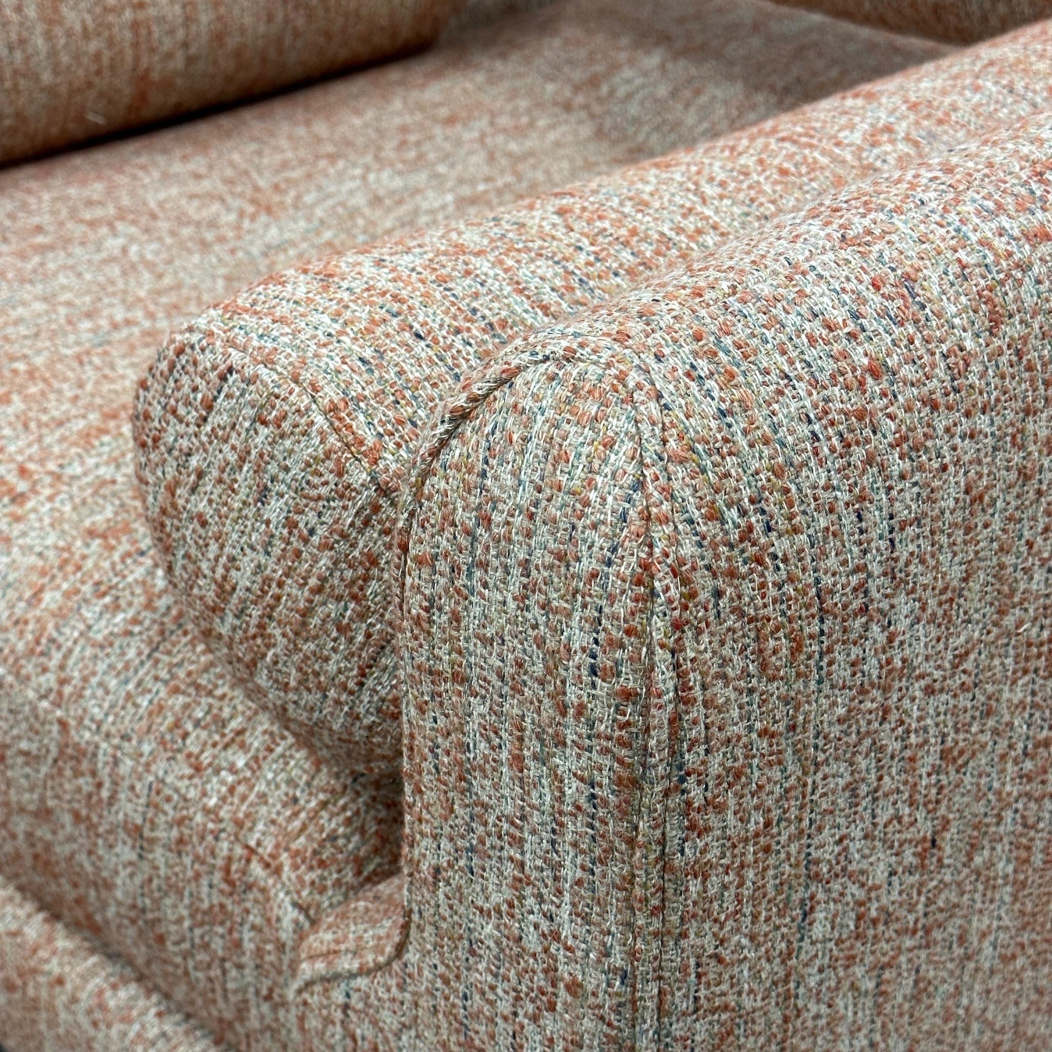c. 2000s. Reupholstered in orange/grey nubby wool boucle. Removable armrests and backrest. Made in USA. 