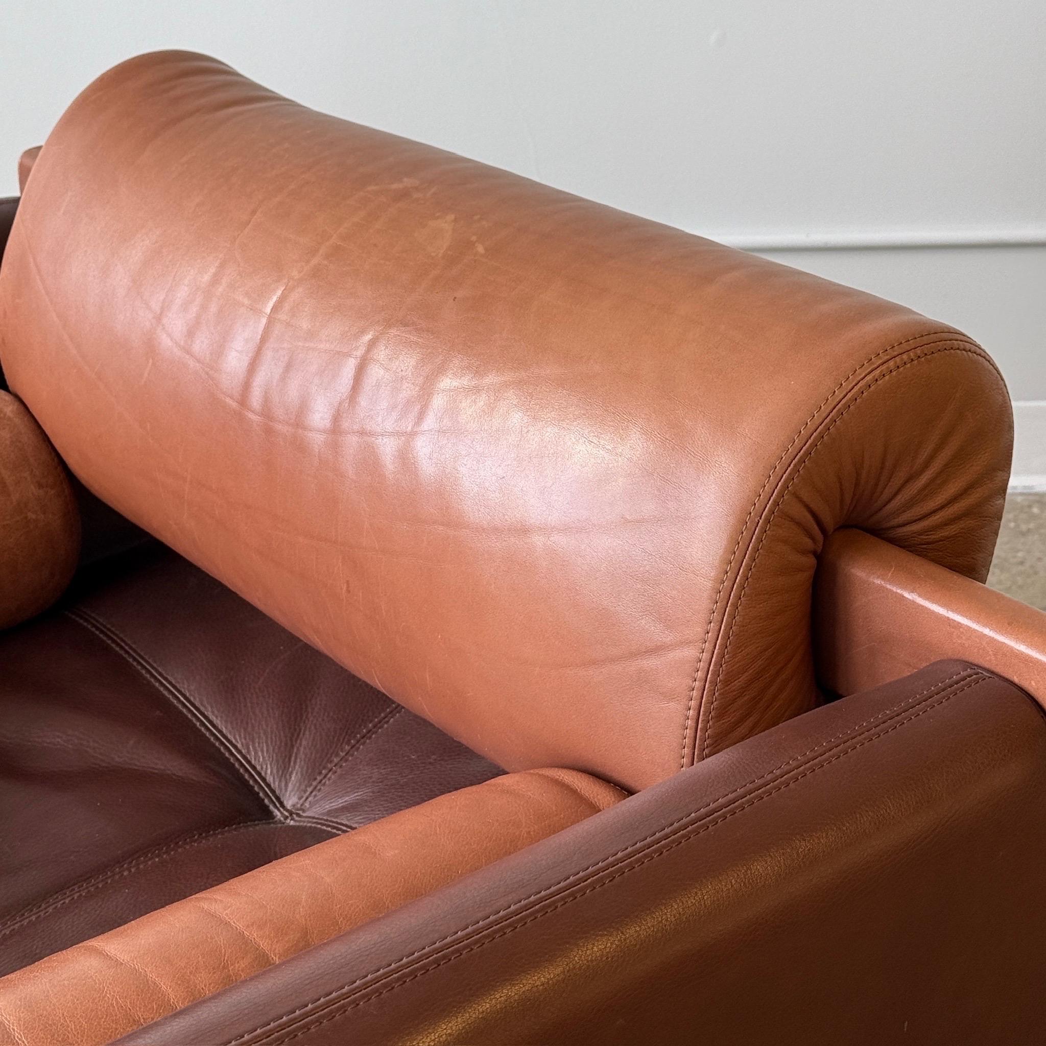c. 2000s. USA. Original two tone leather construction with removable pillows and backrest.

