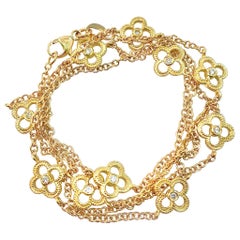 Matinee-Length Diamond Quatrefoil Station Chain in Yellow Gold