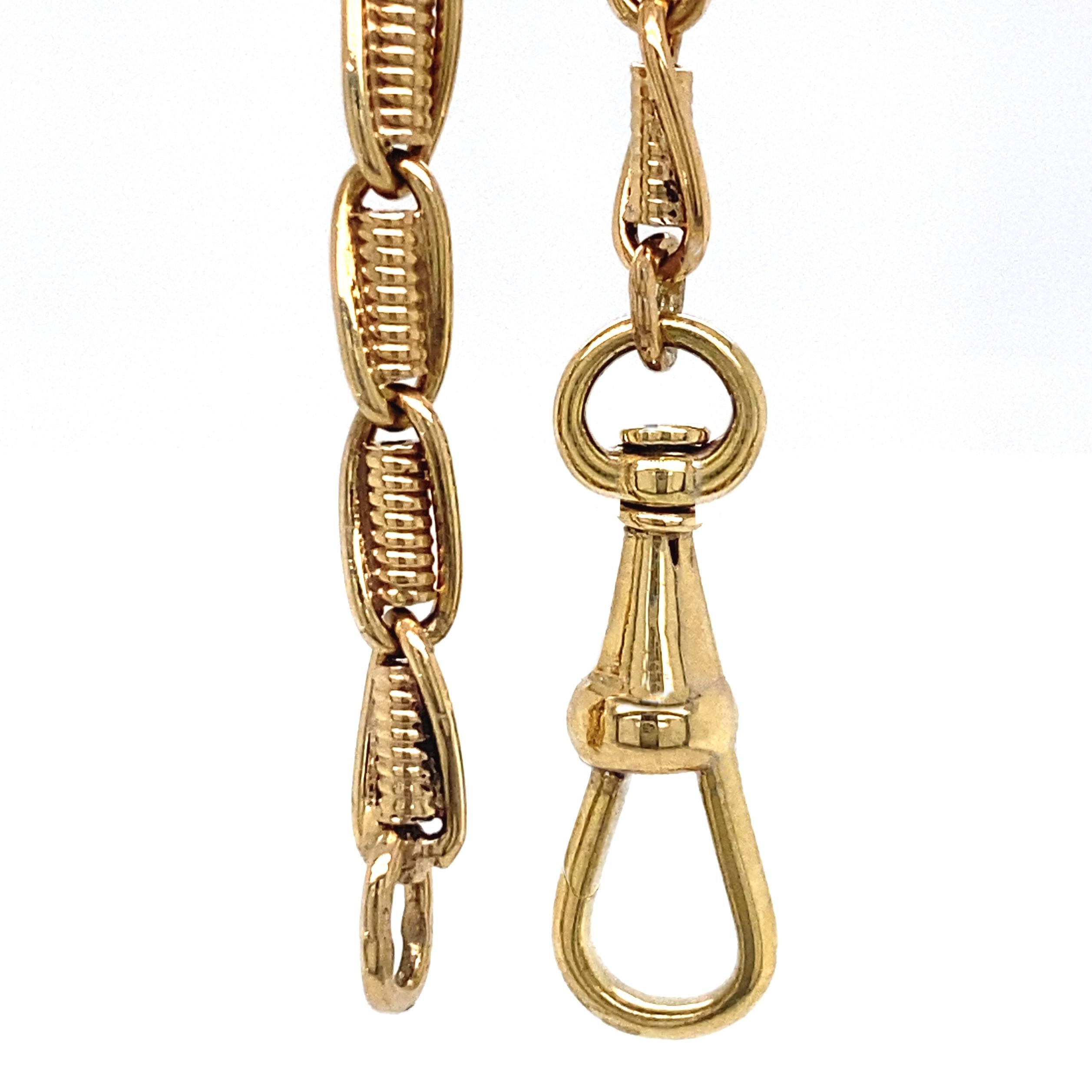 This is an old watch chain that long ago got separated from its watch.  We added a dog (aka swivel) clip and now it's just as moderne and versatile as can be at 21