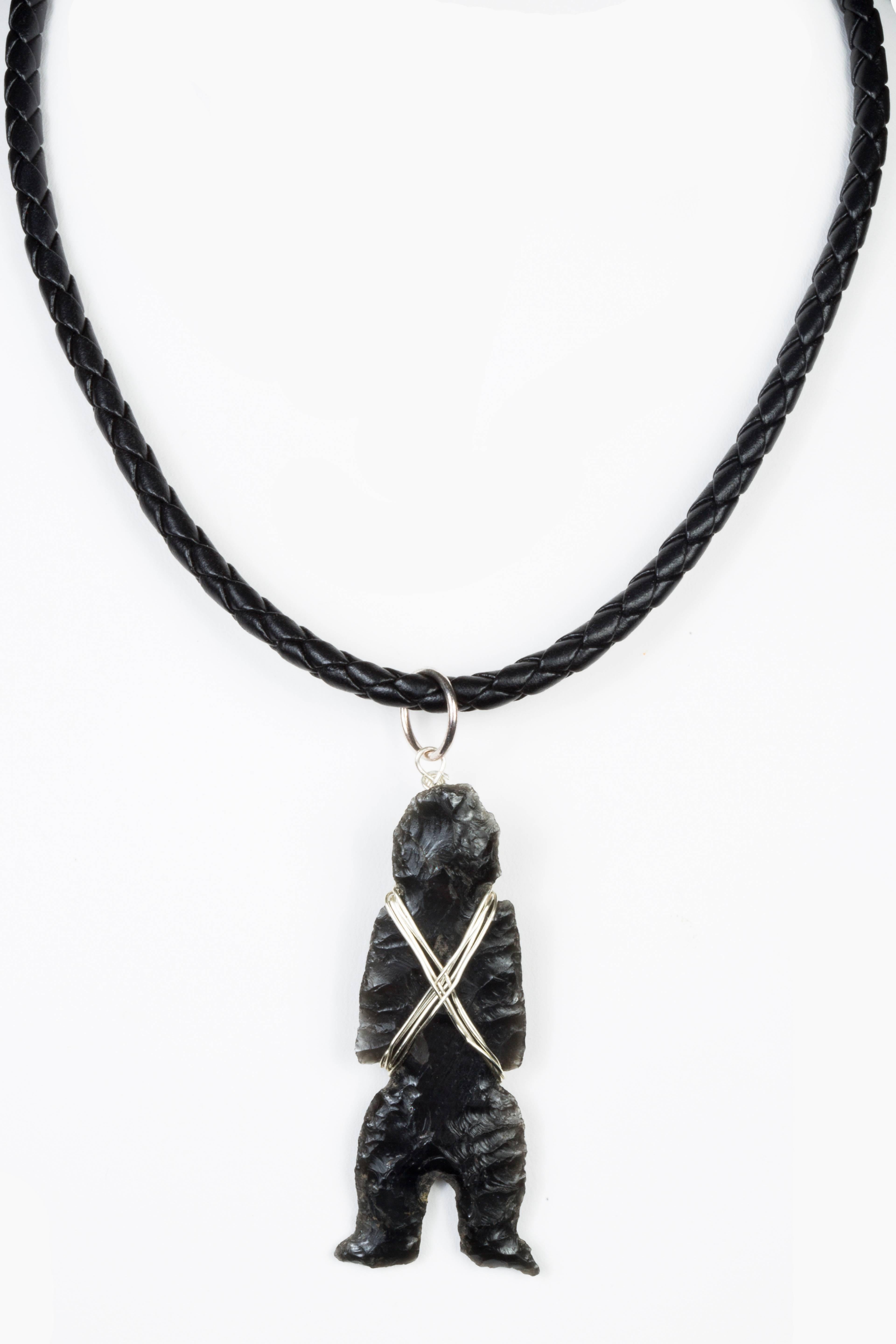 This Aztec Flint Ca. 1300-1521 CE has been carved by hand to represent a shaman. Provenance: Pierre and Tana Matisse Foundation. Modern new string and clasp.

This piece comes from our 