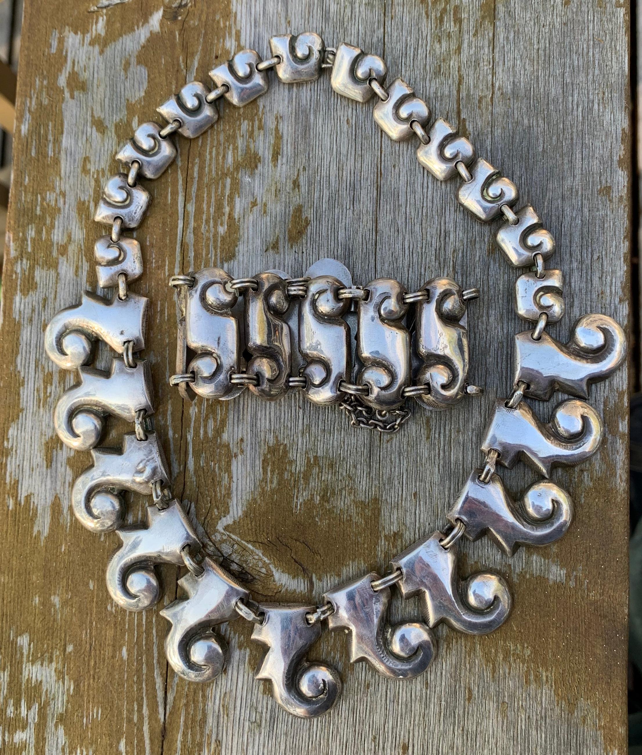 The necklace and bracelet by Matilde Poulat are among the finest museum quality Mexican Silver Necklace and Bracelet Suites.  The pieces are the early work of Matilde Poulat and are both signed MATL in large script.  They epitomize the iconic