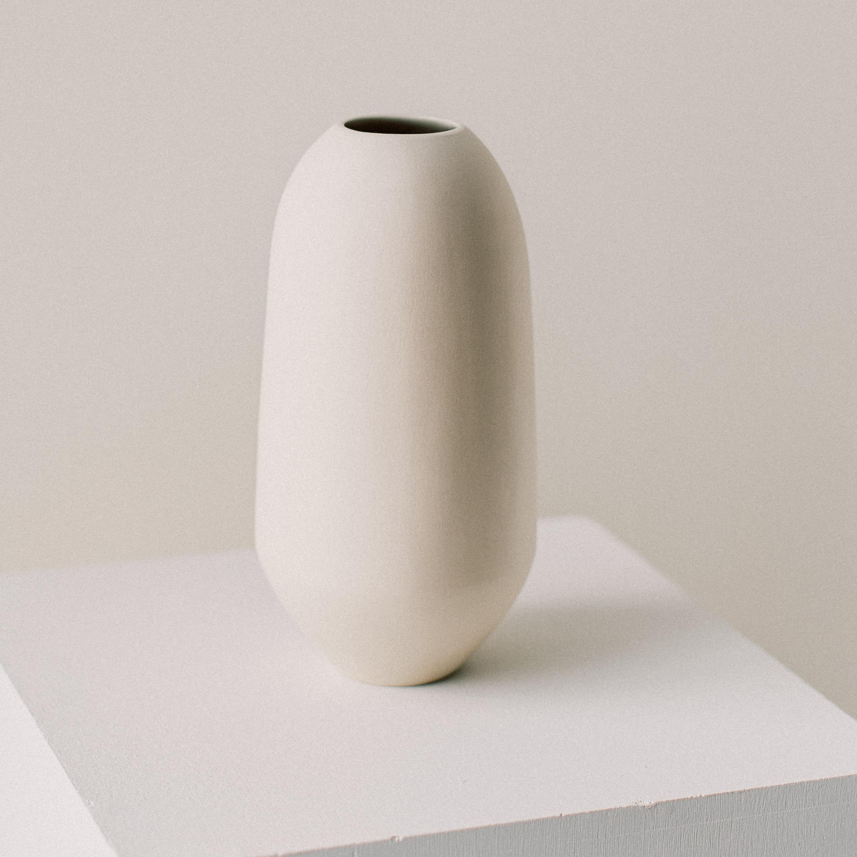 Matriarch vessel by Dust and Form
Dimensions: D 80 x 11.4 H cm
Materials: Porcelain

Origin Form Collection in three finishes: hand-sanded (our classic, smooth, bare finish) Ivory (satin white glaze) Charcoal (matte black glaze). 

A form to